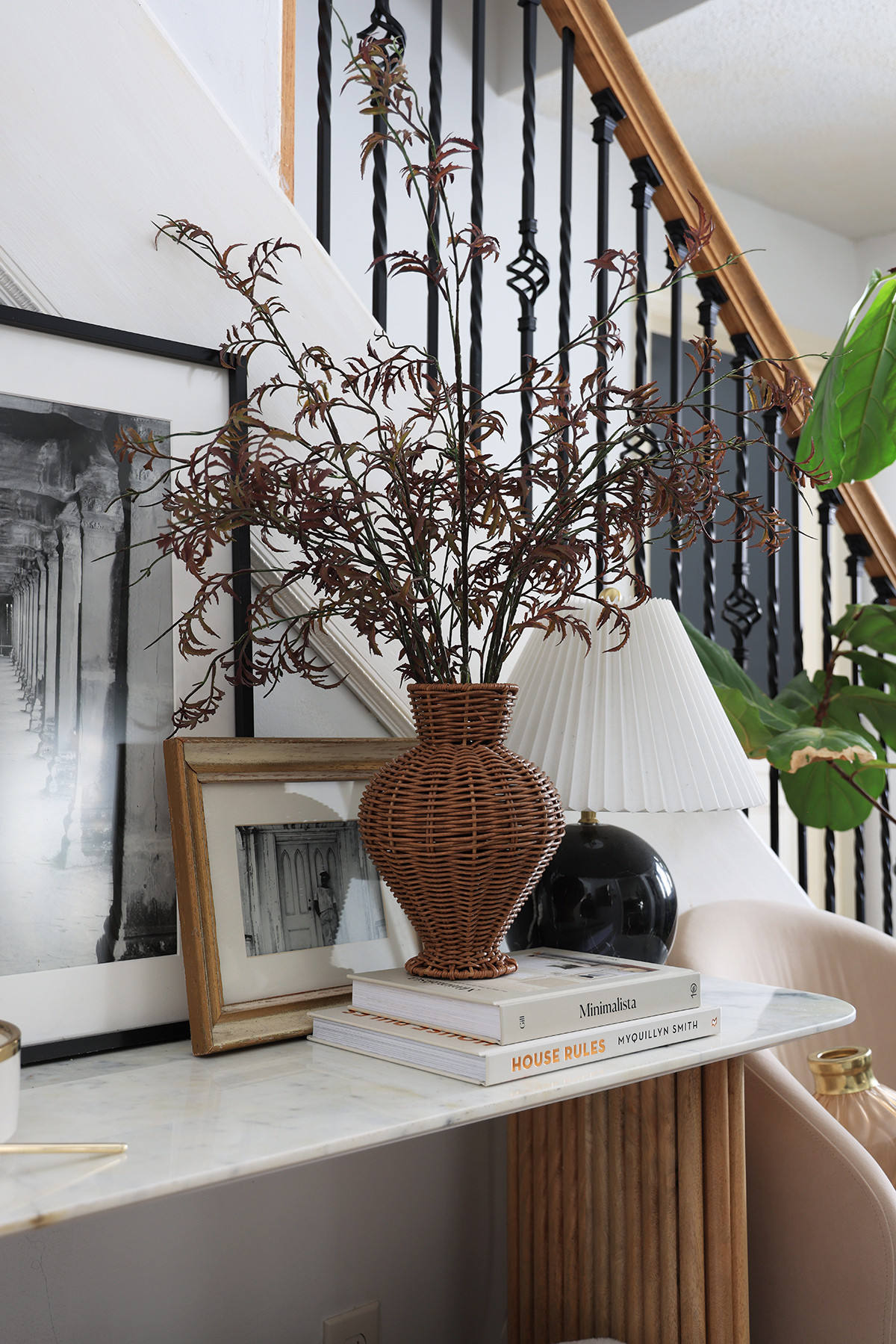Entryway console styling | Woven rattan vase with stems | Fluted shade lamp | Wall art | Coffee table books  

 #LTKHome