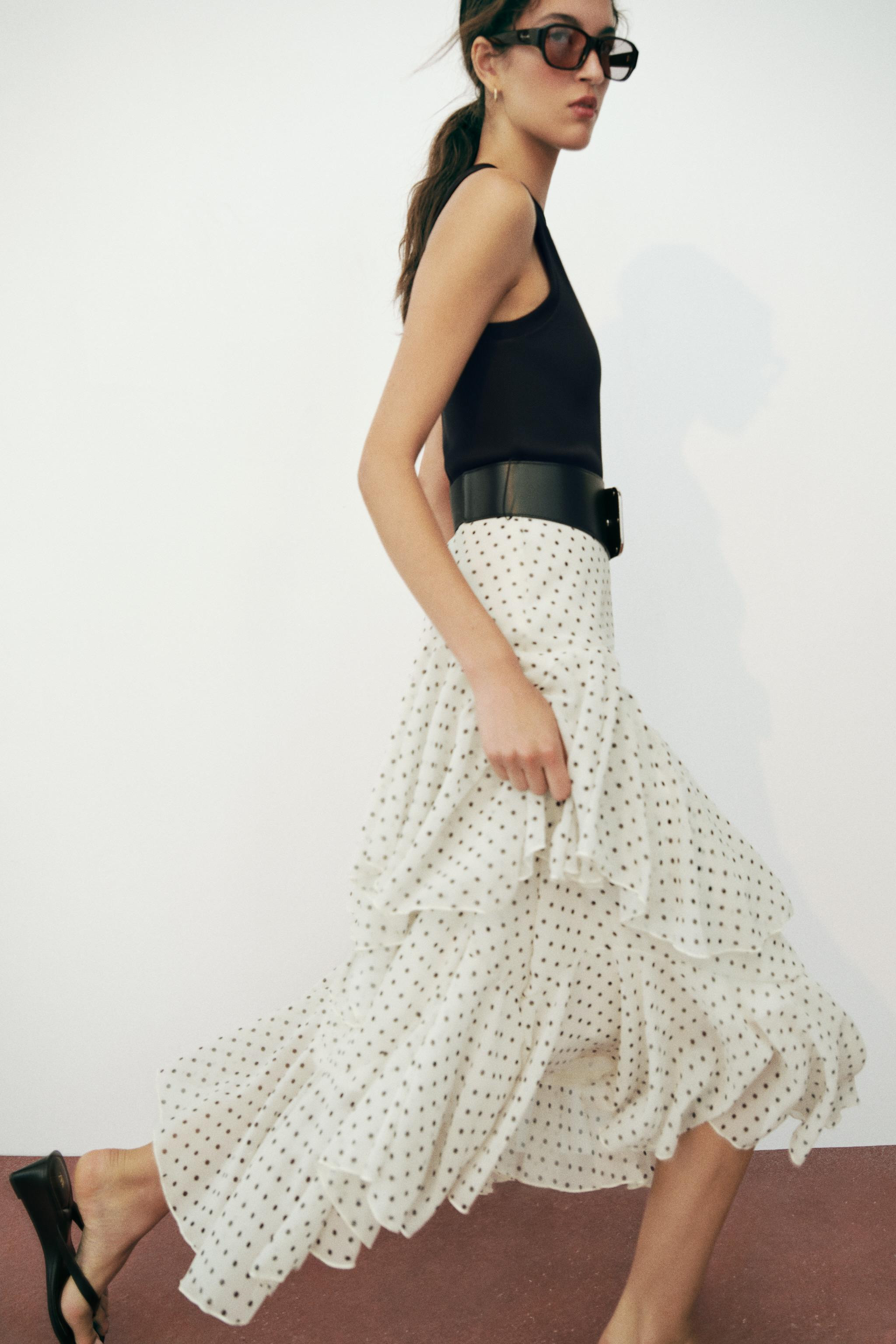 Round neck sleeveless midi dress. Skirt detail with contrasting fabric with ruffles and a belt. I... | Zara US