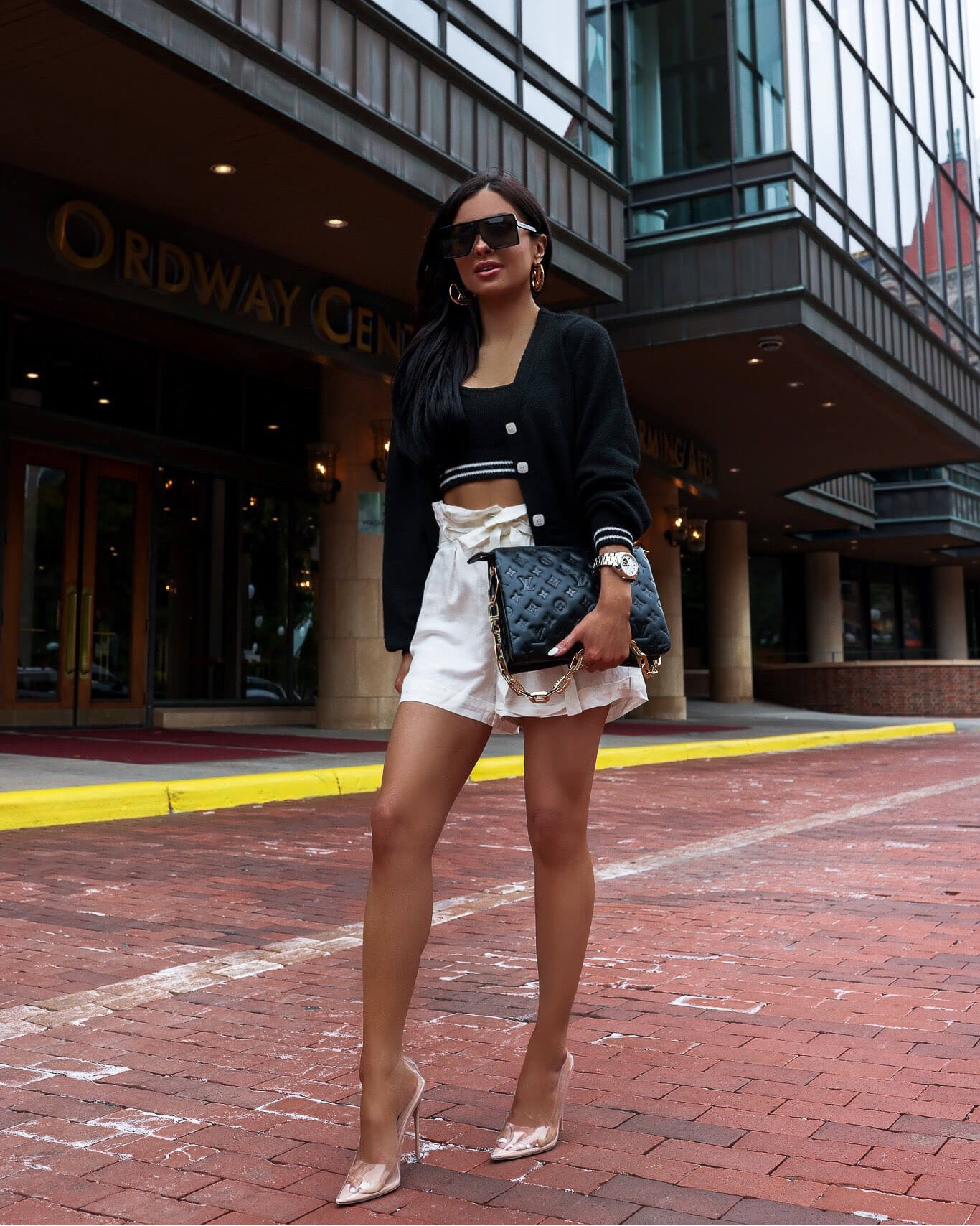 Summer outfit ideas / travel outfit
Black and white cardigan linking similar
White paperbag shorts 

#LTKstyletip #LTKtravel #LTKfindsunder100