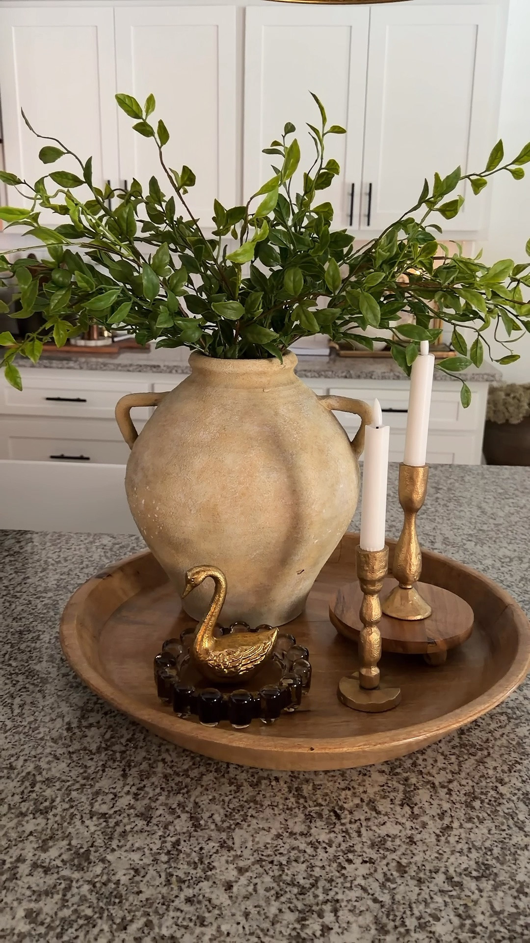 Greenery instantly brightens up any home! I used five stems in this beautiful vase, along with candlesticks, a bubble dish, and a lovely swan to complete the look.