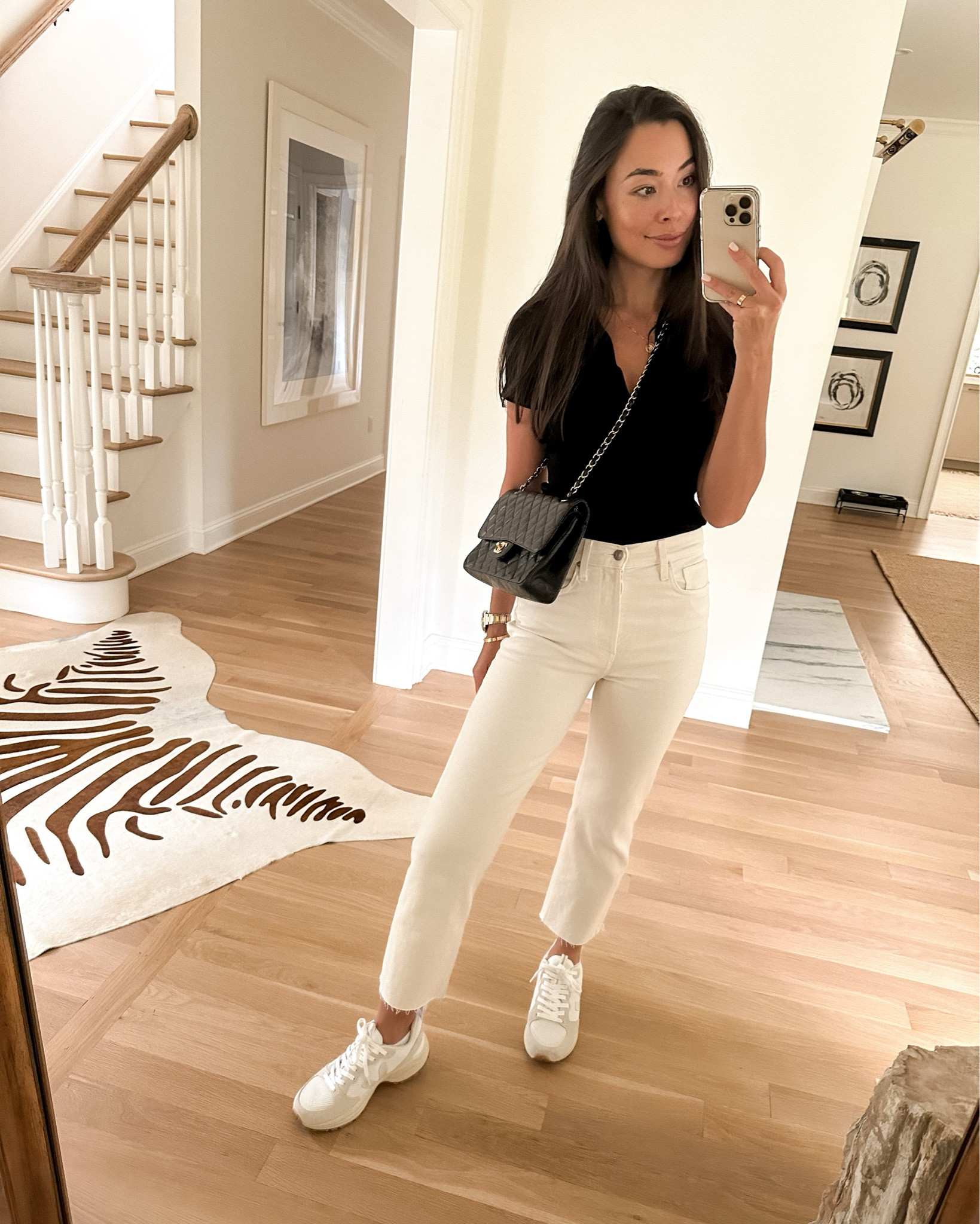 Kat Jamieson wears a polo knit shirt, bone cream denim jeans, Veja sneakers and a Chanel bag.

#LTKSeasonal #LTKitbag #LTKshoecrush