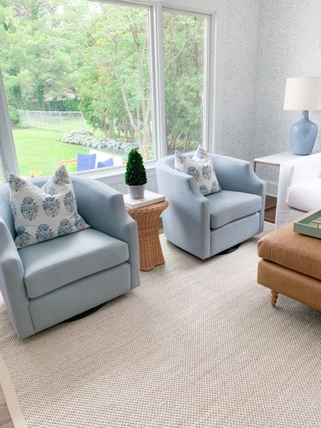 Light blue swivel chairs, living room, affordable rug, pillow, blue and white 

#LTKhome #LTKfindsunder50