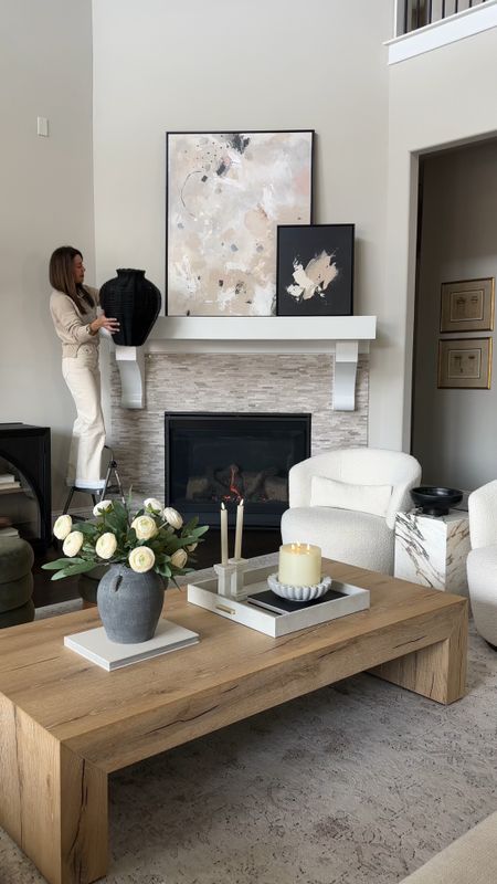 I refreshed my living room fireplace mantel with these beautiful and realistic leafy greenery! Also my hand woven vase is on sale!! My abstract art, coffee table, best selling area rug, and everything as seen here is linked. Including the decor I used to style my coffee table 

#LTKstyletip #LTKhome #LTKVideo
