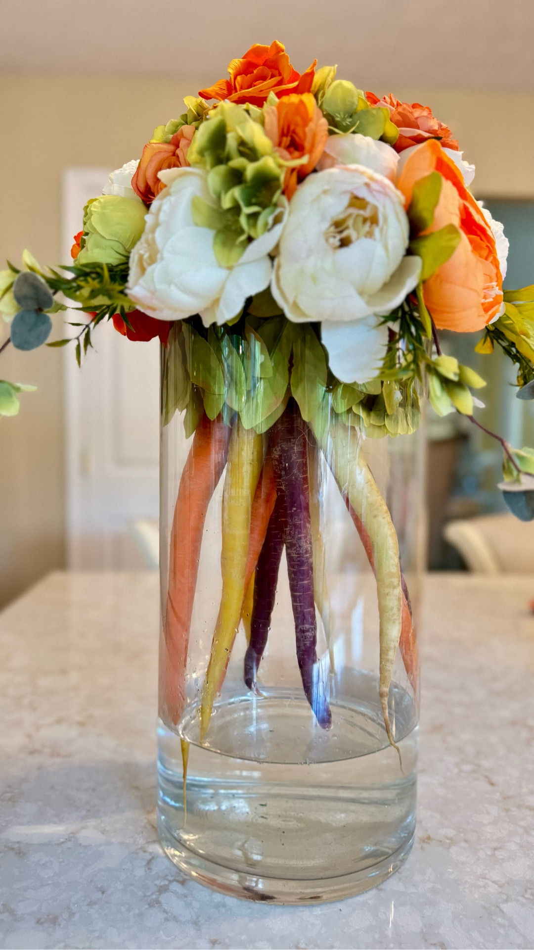 Fresh from the garden and full of whimsy 🌿🥕 This spring-inspired centerpiece combines bright blooms with rainbow carrots for a playful, farm-to-table floral twist!

#FloralArrangement #SpringCenterpiece #GardenInspired #FarmhouseDecor #DIYFlowers #ColorfulBlooms #CarrotVase #WhimsicalDecor #JustJennsDesign #InstaHome #FloralInspo #TabletopStyle #FreshAndFun #HomeStyle #FlowerLovers #CreativeCenterpiece #InteriorDetails

#LTKSeasonal #LTKHome #LTKBeauty