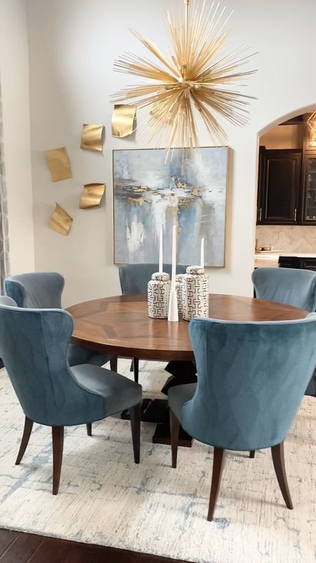 Transitional modern dining room with round table dining chairs abstract art decorative jars candle #homedecor #decorating #art

#LTKhome #LTKsalealert #LTKstyletip