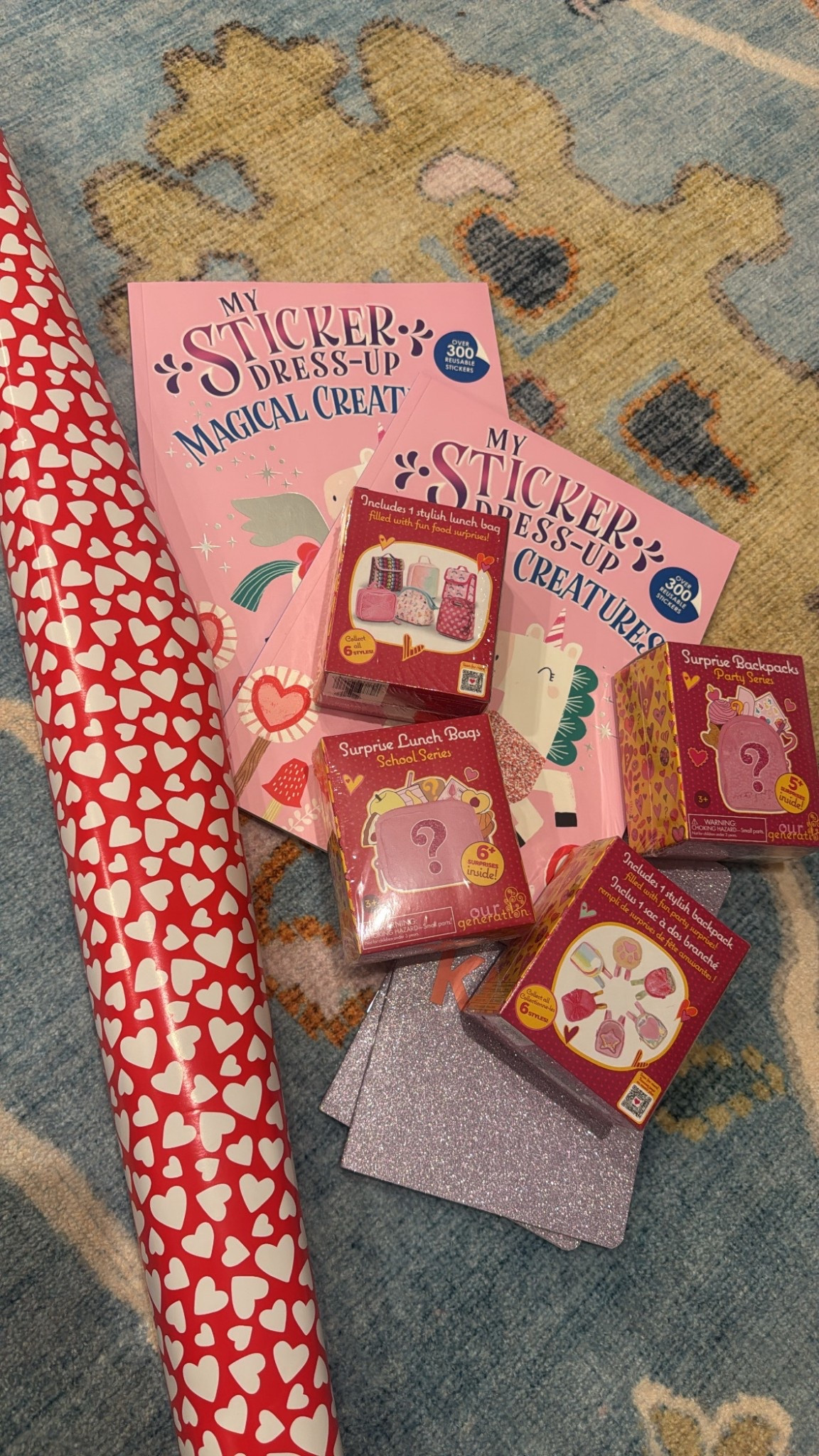 Late night Valentine's Day prep for my girls! They love these surprise doll accessories. We have the lunch boxes, backpacks, and suitcases! Get this cute $4 heart paper for pickup!!