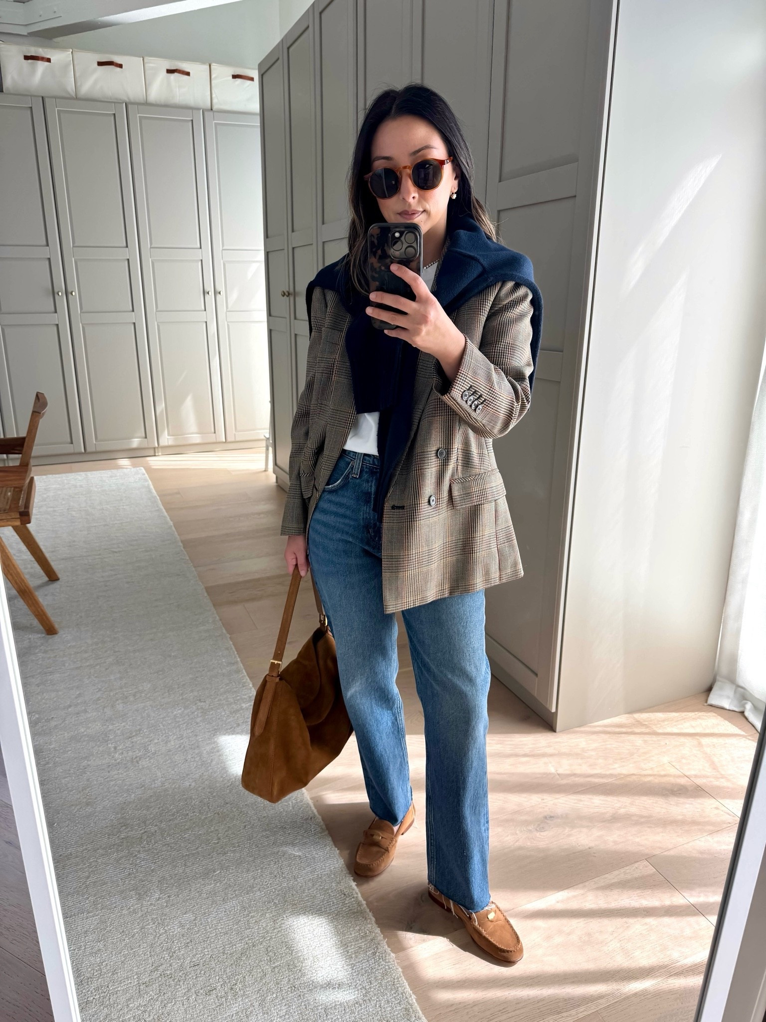The perfect combo to feel like fall. Obsessed with a navy and check blazer 🍂😮‍💨. 

Aritzia tee medium
J.crew blazer 4 petite. Size up a few sizes for a roomier fit. 
Everlane cotton sweater xs
AGOLDE Valen jeans 25. Cut hems
Veronica Beard loafers 5.5
J.crew bag
Le Specs sunglasses
Dorsey James necklace 15”
Dorsey Cecilia earrings 3.4