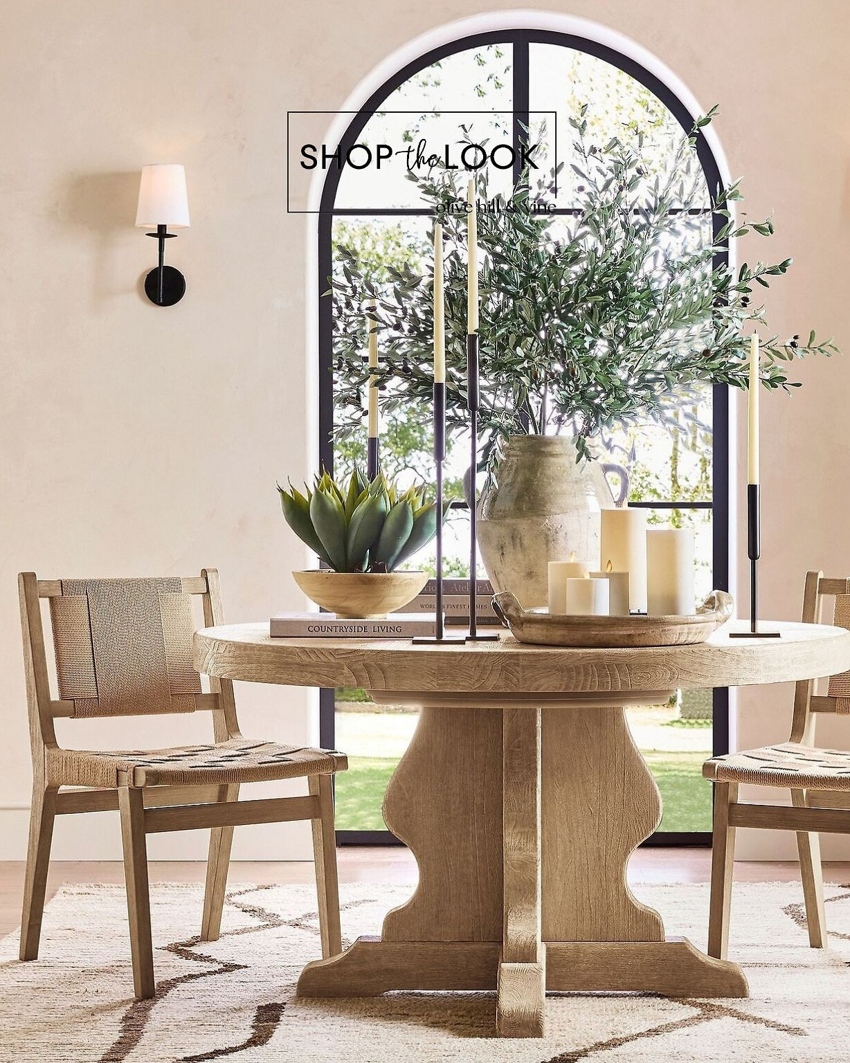 Soft textures and warm neutrals anchor this airy dining moment. A sculpted pedestal table, woven chairs, and simple candlelight make the space feel effortless and inviting—timeless pieces that bring natural ease to everyday living.  

 

#LTKHome