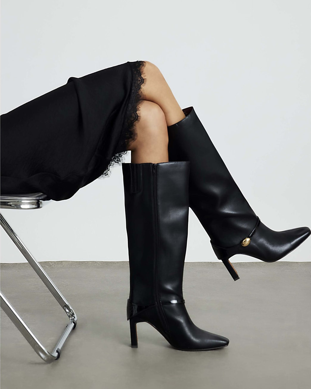 Black High Leg Gold Hardware Heeled Boots | River Island UK & IE