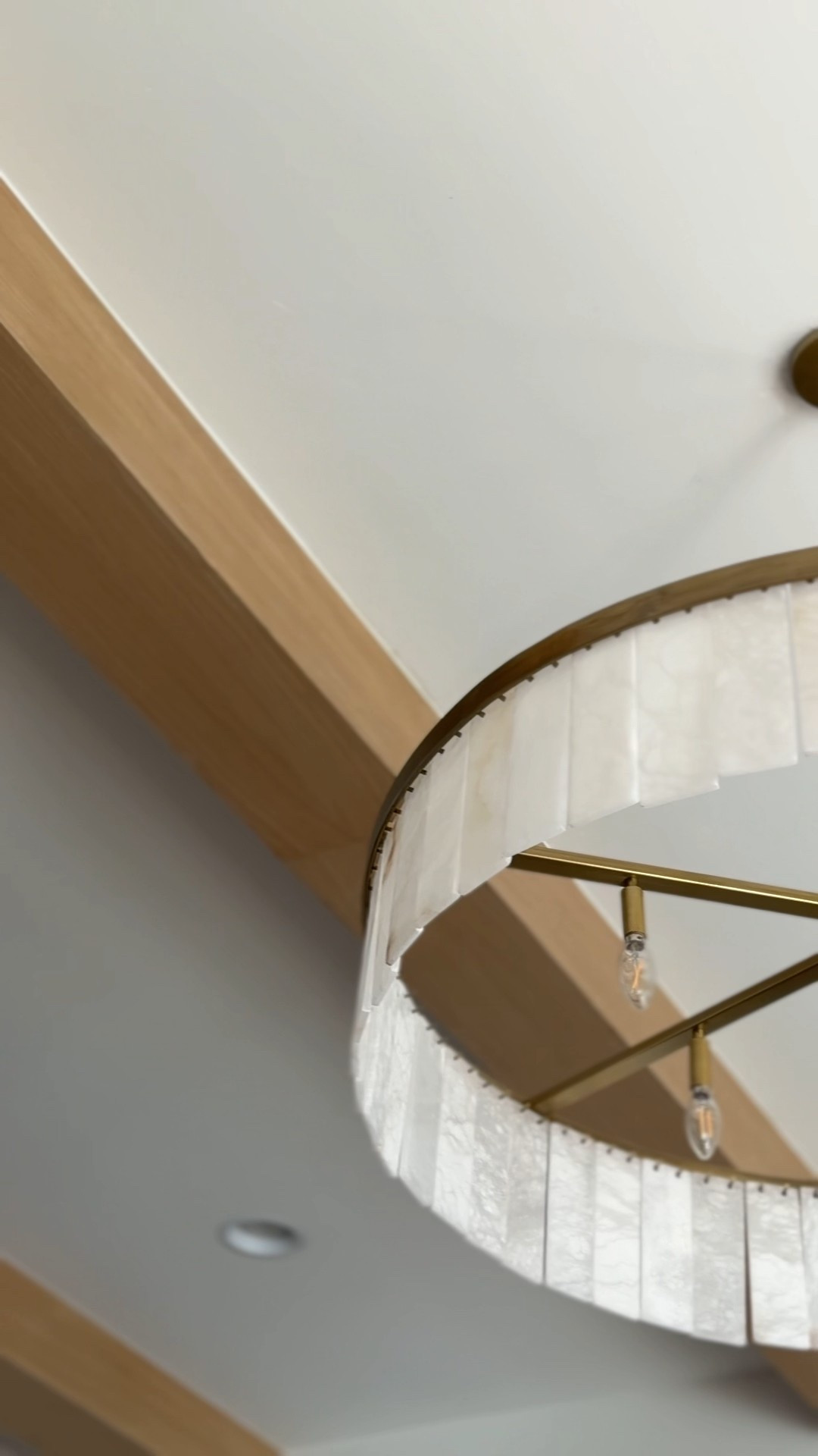 My most popular light fixture and forfor good reason! This beautiful brass chandelier with alabaster plates is truly unique. 

Windham alabaster brass circular chandelier, Pottery Barn lighting, alabaster plate chandelier, brass chandelier, circular chandelier, modern classic lighting, luxury ceiling light, statement chandelier, neutral home lighting, warm brass lighting, living room chandelier, dining room chandelier, entryway chandelier, high-end home decor, timeless lighting design, modern traditional chandelier, alabaster stone lighting, elegant ceiling fixture, designer chandelier, layered alabaster light, soft ambient lighting, elevated interior design

#LTKHome #LTKSeasonal