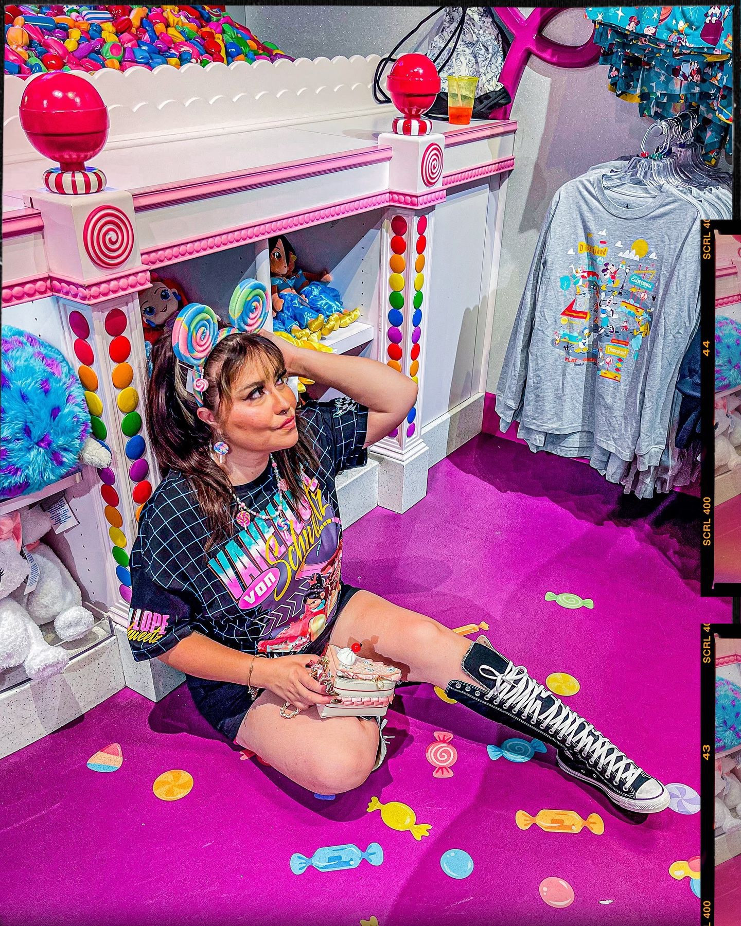 “I’m Vanellope von Schweetz, As your merciful princess, I hereby decree that everyone who was ever mean to me shall be… executed.”
. I wanted to capture Vanellope Von Schweetz Spunky and sweet style with this Disney bound look. 🍭🍬🏎️👾🎮🌈
.. 📸 @johmajesty 
..
🍭FIT DEETS🍭
. TEE It’s called winning!🥇@boxlunchgifts 
. SHOES Sky High @converse 
. BAG on my Amazon store 🔗 link in bio
. Ears @disneyparks 
. Necklace @magicallysarita with interchangeable lollipops DIY by me
. Candy hair accessories DIY 
..
..
.. 
..
..
..
.#disneystyle #disneybound #disneycontentcreator #disneycreators #disneyinfluencer #disneybounding #thedisneybound #vanellopevonschweetz #wreckitralph #pixarfest #pixarmovies #youremyhero #disneyland #disneycaliforniaadventure #pixarpier #bingbongssweetstuff #sugarrush #candycrush #altstyle #altfashion #altdisney #sweetascandy

#LTKSeasonal #LTKShoeCrush #LTKStyleTip