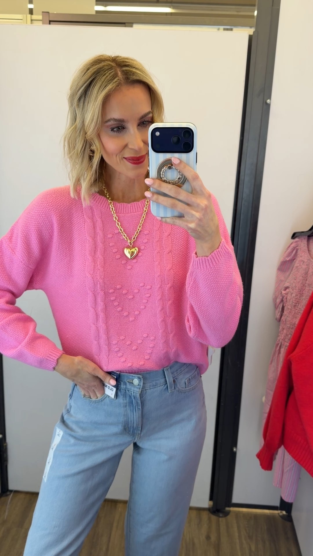Pink heart sweater for Valentine’s Day and old navy jeans! I’m either a 2 or 4 and wearing a size 2 in the jeans here  