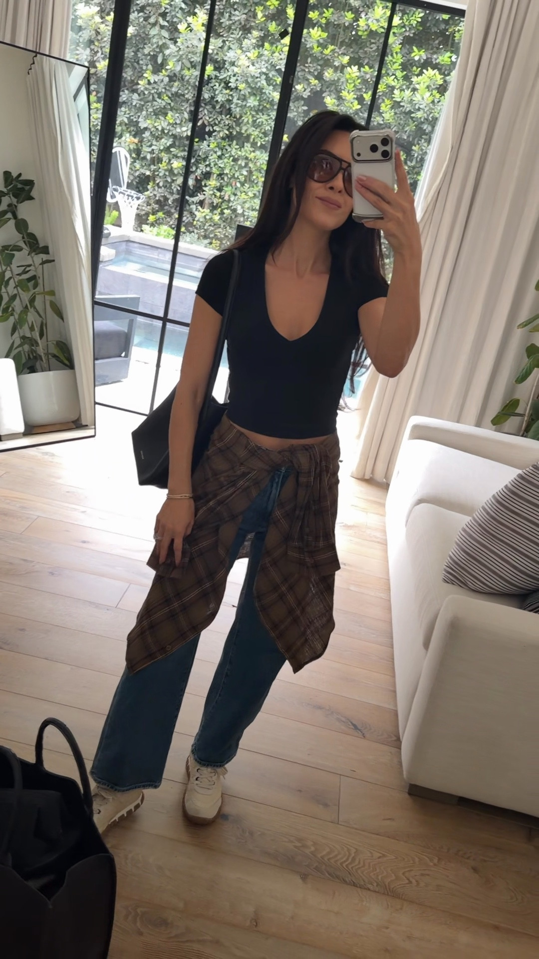 A quick flight might go to basics for travel and rolling straight into lunch. I am obsessed with these jeans, flattering and stretchy. This new basic is worth a splurge. I’m wearing an extra small my every day mom bag and adding a little personality with a wrapped flannel around my waist and some new sunnies that I’m obsessed with.

#LTKmomlife #LTKTravel #LTKOver40