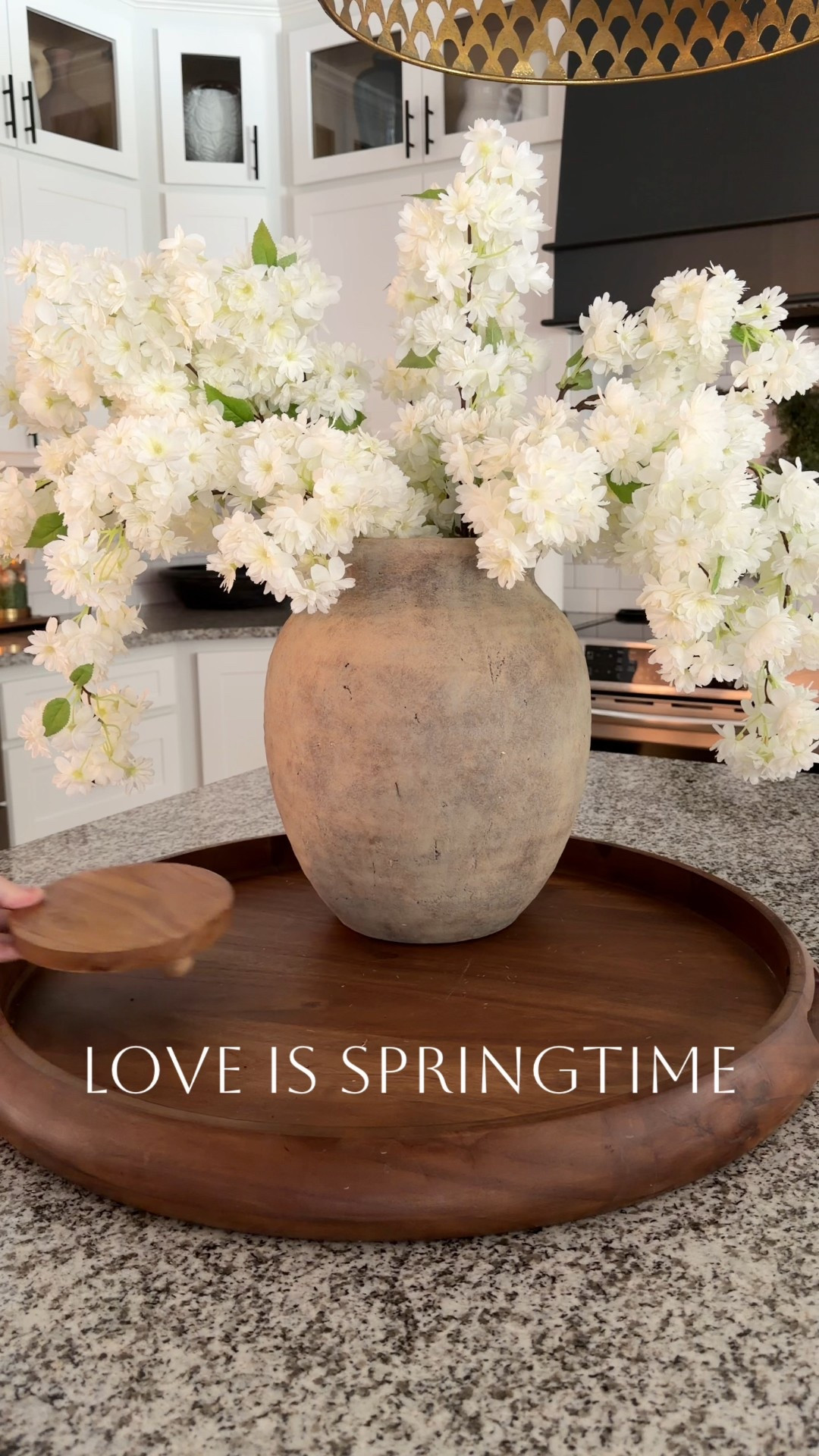 This vignette features beautiful Cherry Blossoms! I added in gorgeous candlesticks and a terracotta bird. This look will totally welcome Spring into your home. 