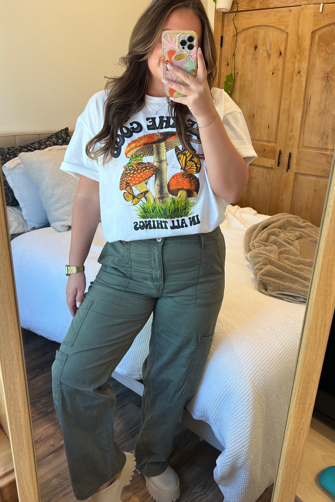 These Walmart cargos and sooo good for $18 👏🏼👏🏼 for some reason the tshirt is $23 online but I paid $7 in store! SIZE DETAILS: large in cargos | xl in tshirt | true size 7 in clogs | graphic tee • early fall style • cargo pants • chunky clogs 

#LTKSeasonal #LTKfindsunder50