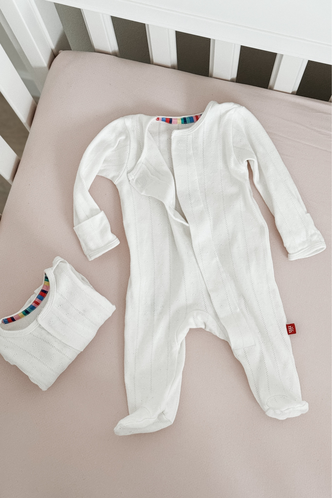 I wish I had known about these footie pajamas with my first baby! The magnetic closure makes them a dream product for newborn parents — I LOVE a double zipper, but this design is my new favorite, especially for those middle-of-the-night diaper changes! 
They offer a variety of fabrics, colors and prints, but this pointelle fabric in color “tofu” is my favorite. I even bought a few spares for the inevitable blowouts so I always have a clean one. 😂 

*New Parent Note: these are also -perfect- for doctor appointments so you don’t have to deal with fussier outfits.

#LTKBump #LTKBaby