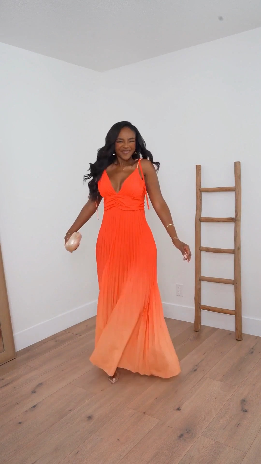 Hi Babes! 🧡✨

This sunset ombré maxi is EVERYTHING for vacation season! The vibrant orange fades into the prettiest peachy hue, and the flowy pleated skirt makes every step look so dreamy.

✨ Fit Details:
• True to size
• Wearing a size Small
• Adjustable straps
• Flattering ruched bodice
• Lightweight, flowy fabric

🌴 Where to Wear:
• Beach vacation
• Resort dinners
• Summer weddings
• Tropical getaways
• Sunset photos

✨ Style Tip:
Keep the accessories minimal and let the dress do all the talking. A neutral clutch and delicate jewelry are all you need!

Everything is linked below!

xx, Kira | IG: KirasFashionFinds

Measurements:
Kira: 5'4" | Size Small | 140 lbs