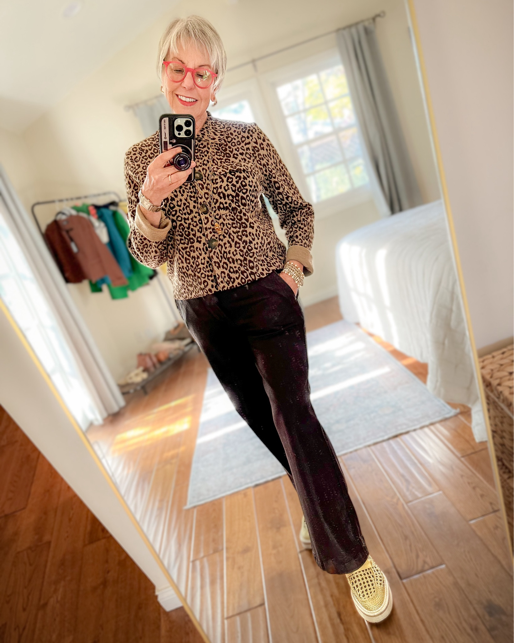 Dressed-up casual: leopard print cardigan, coated denim trousers, metallic loafers, gold jewelry. 

I’m wearing size Small in the cardigan and 27 in the pants (they run large so size down!). Gold loafers no longer available, have linked to similar style  

#LTKstyletip #LTKover40 #LTKSeasonal