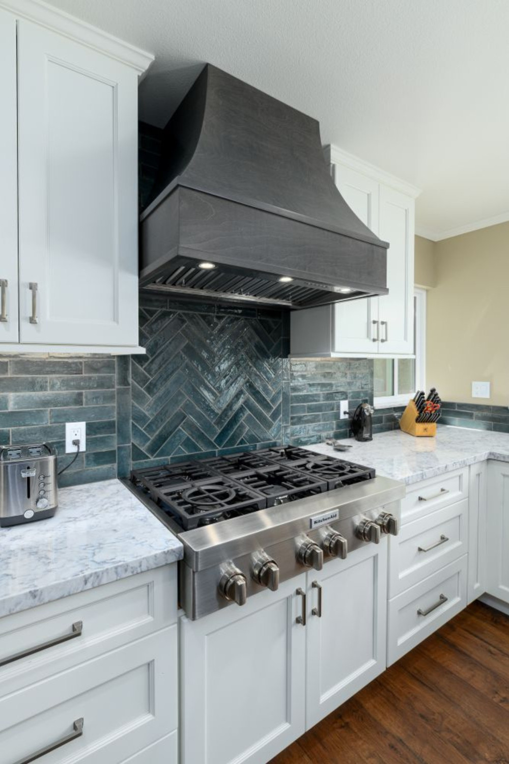 When thoughtful design meets expert craftsmanship. This kitchen features a bold custom-stained wood range hood that anchors the space, paired with a handcrafted herringbone tile backsplash for added texture and depth. We provided full-service design, project management, and custom cabinetry to ensure every detail—from finishes to functionality—was perfectly executed.

Our design-build team simplifies the remodel process by handling everything in-house, from concept to completion, including cabinetry, tile, and materials.

Looking to reimagine your kitchen? Save this for inspiration and follow along for more!

#KitchenDesign #CustomRangeHood #TileBacksplash #HerringboneTile #KitchenRemodel #DesignBuild #CustomCabinetry #FullServiceRemodel #LTKHome #LTKKitchen #KitchenGoals #InteriorDesign #KitchenInspo #SemiCustomCabinetry #StatementHood #HomeRenovation #CaliforniaHomes #BeforeAndAfter #KitchenInspiration #KitchenDetails #LuxuryKitchen #KitchenUpdate #TimelessDesign #DreamKitchen 

 #LTKHome