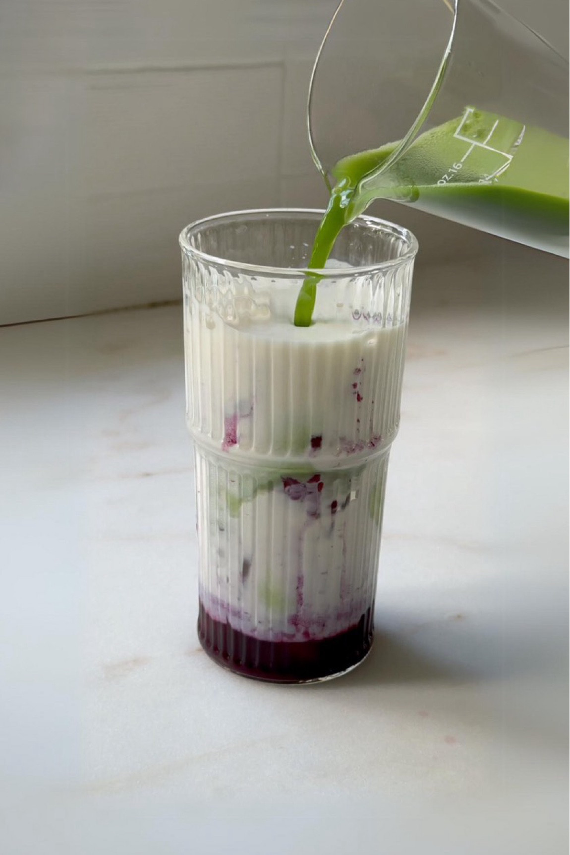 This is my take on the nitrobar blueberry latte, mine is made with matcha 🍵 

To make ⬇️ 

Add 1 cup of blueberries to a pan on medium heat. 

Roughly mash with the back of your stirring spoon, then add in 1 cup of water. 

Use a potato masher to continue the process of mashing all of your blueberries. Once the mixture starts to boil, reduce to a simmer. Use your potato masher to roughly remove the blueberry skin, alternatively you can let cool and add to a blender after you’ve added sugar.

Add 3 tbsp sugar - I used agave but cane sugar would work well too.

Let cool then strain into a jar and enjoy within the week. Make sure to keep stored in the fridge.

#matchalatte #blueberrylatte #nitrobar