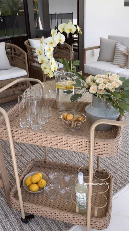 This beautiful @wayfair outdoor wicker bar cart is part of their big outdoor sale ☀️  #wayfairpartner #wayfair

#outdoordecor #patiodecor #homedecor #wayfairfind #hosting #entertaining #brunch #glassware #vase #outdoorfurniture #barcart #outdoorbarcart #wicker 

#LTKsalealert #LTKSeasonal #LTKhome