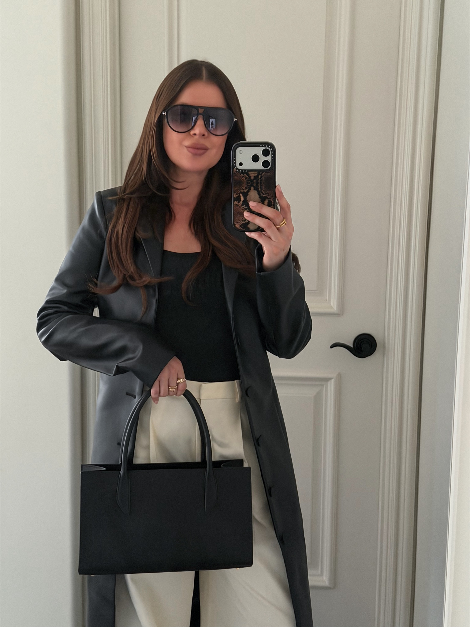 The perfect spring outfit for work or for running errands if you want to look put together and chic! 

Styling a black leather trench coat with a charcoal tank, nude wide leg pants, black leather sling backs and a small black leather tote. Adding gold jewelry and aviator sunglasses to finish the look.

Everything size S, fits true to size. 

#LTKWorkwear #LTKgrwm #LTKootd