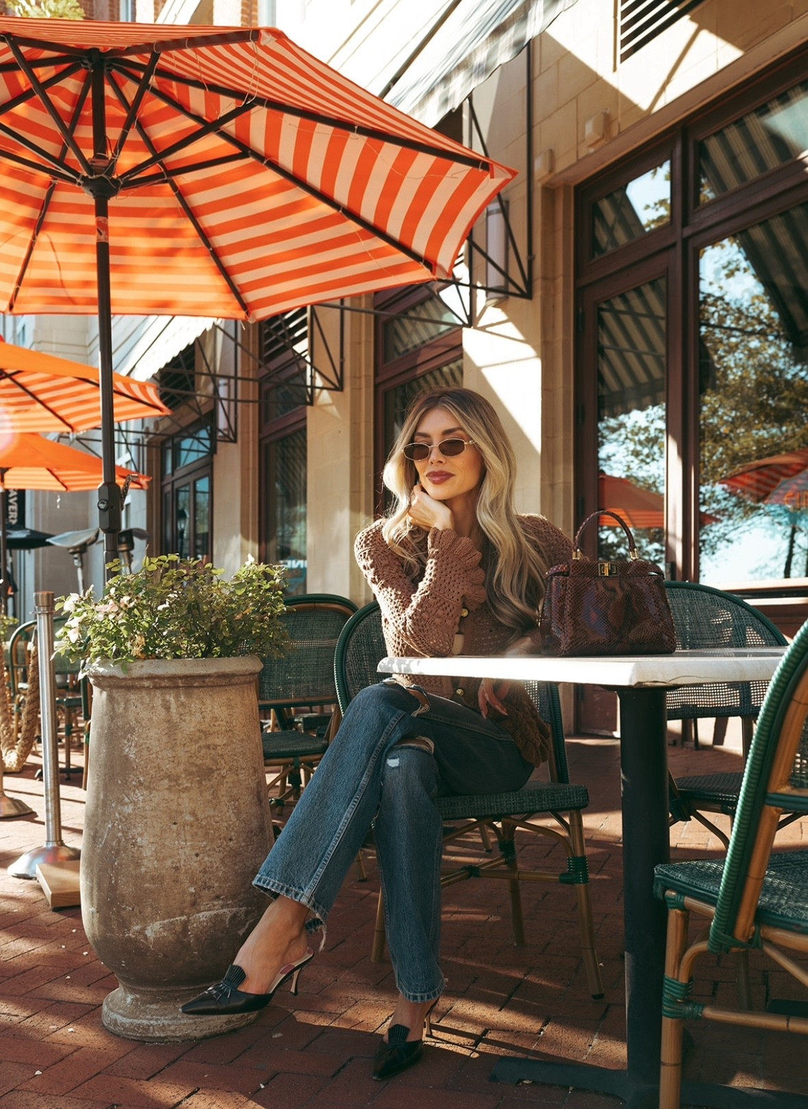When your perpetually late friend says she’s just around the corner…🤥  My crocheted sweater is from L’Agence. I picked up these oval Gucci sunnies in DC, and linked a similar python Fendi peekaboo bag. 

#LTKStyleTip #LTKSeasonal #LTKBeauty