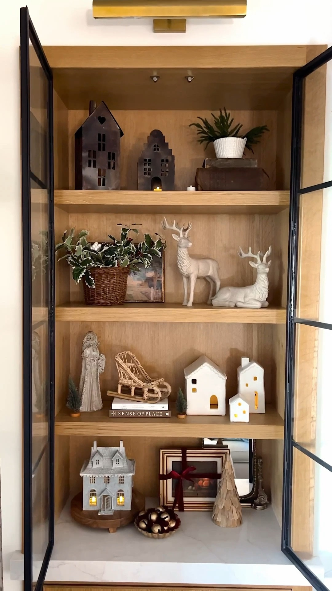 I got all of my living room shelves styled for Christmas and this is the first side all done! I absolutely love getting to style these built ins with little houses, animals, Santa, greenery, and more!! 

#LTKHoliday #LTKHome #LTKSeasonal