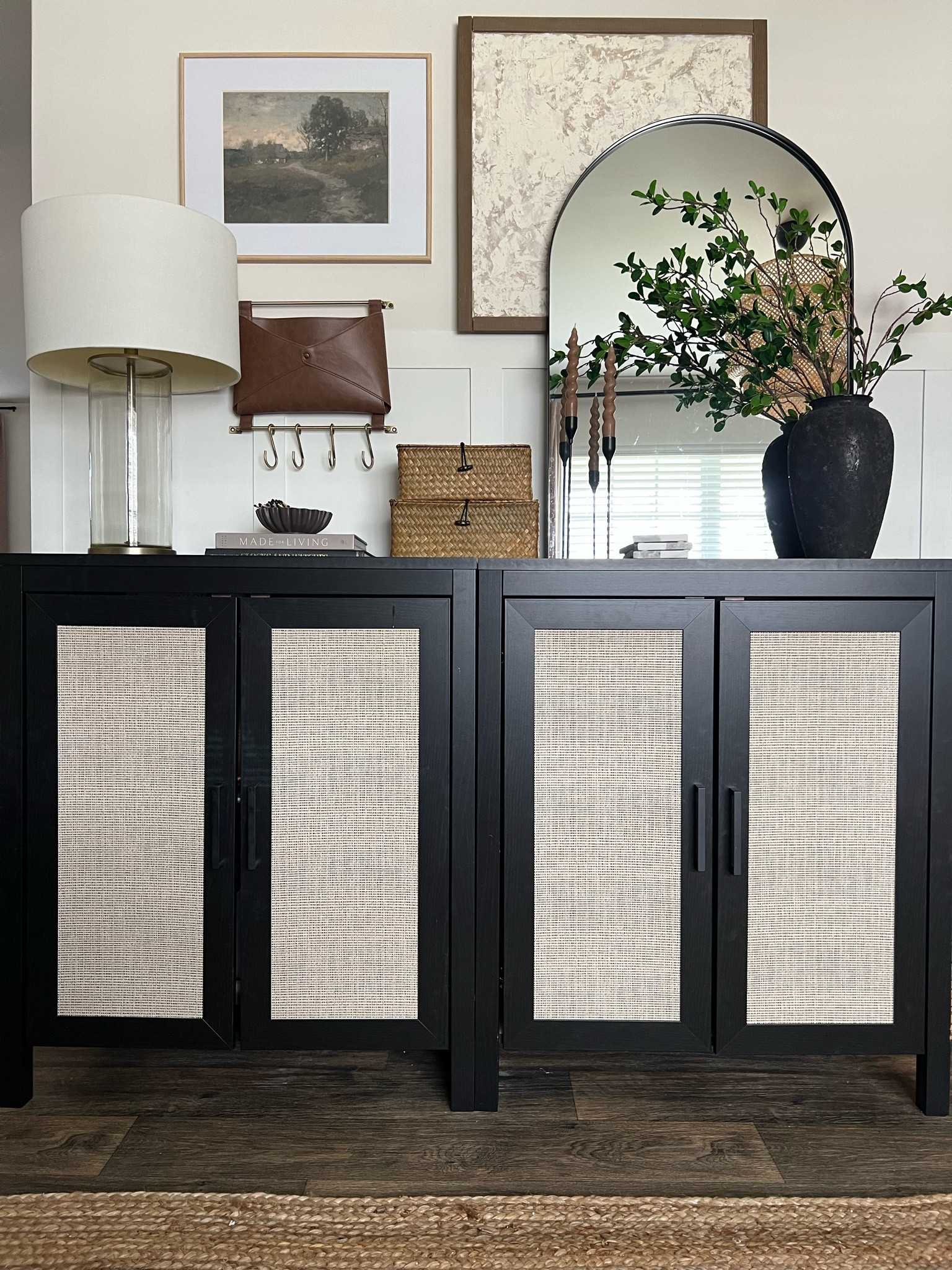 Sideboard styling refresh, organic modern home decor, console table styling, woven stacking boxes, black arch mirror, faux rattan sideboard, rattan accent cabinets, Temu home decor finds, scalloped bowl, brown candlesticks, long stemmed greenery, vintage art prints, jute rug

#LTKfindsunder50 #LTKsalealert #LTKhome