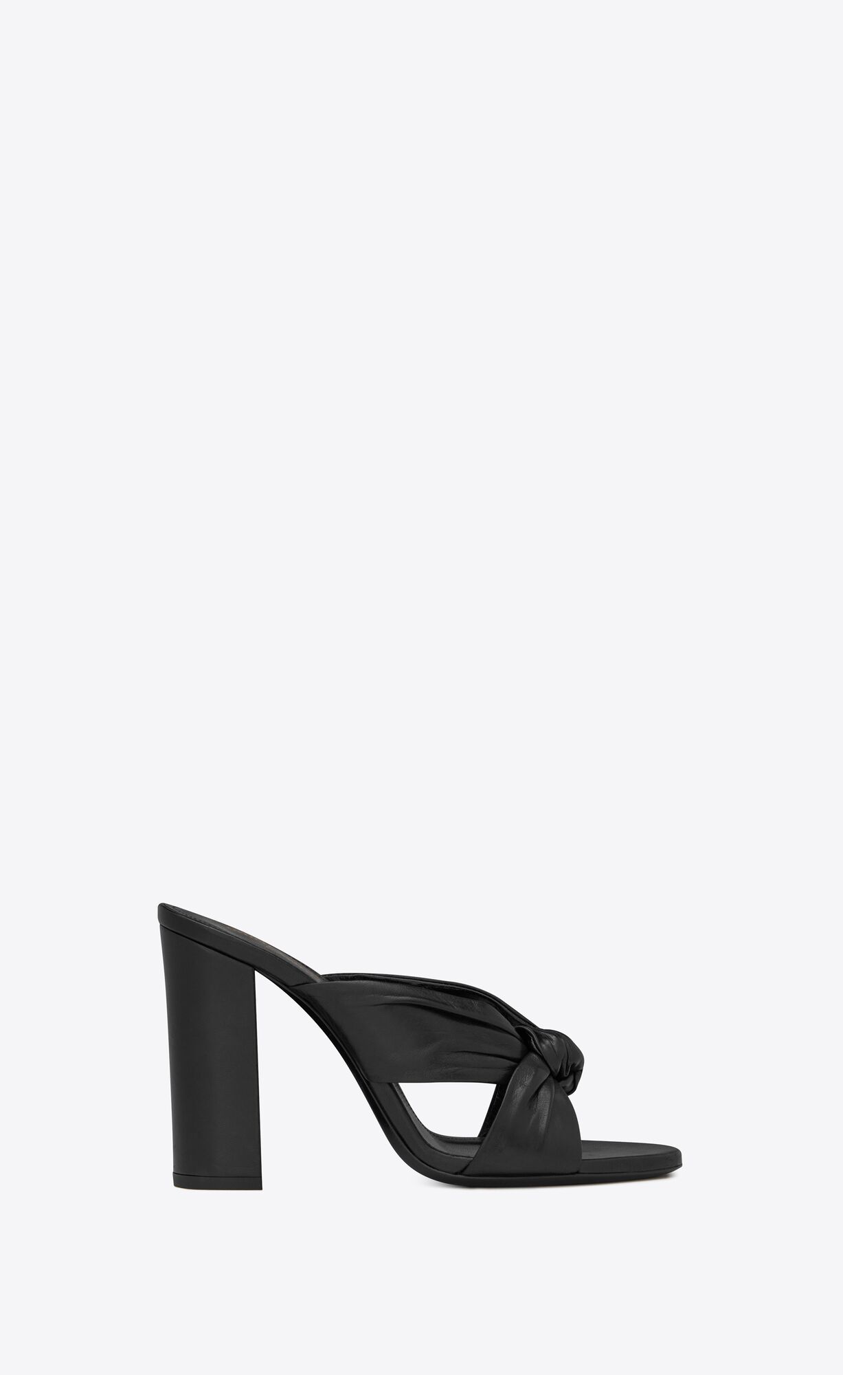 Mules with crisscrossed front tied in a knot, featuring a round toe and a covered block heel. | Saint Laurent Inc. (Global)