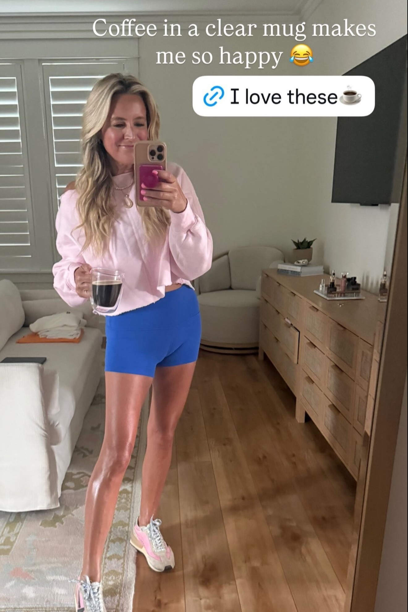A colorful activewear moment 💕 This pink pullover, bright blue athletic shorts, and fun sneakers make the cutest outfit for morning walks, coffee runs, and casual summer days. And yes, coffee really does taste better in a clear mug 😂 

 #LTKgrwm #LTKootd #LTKActive