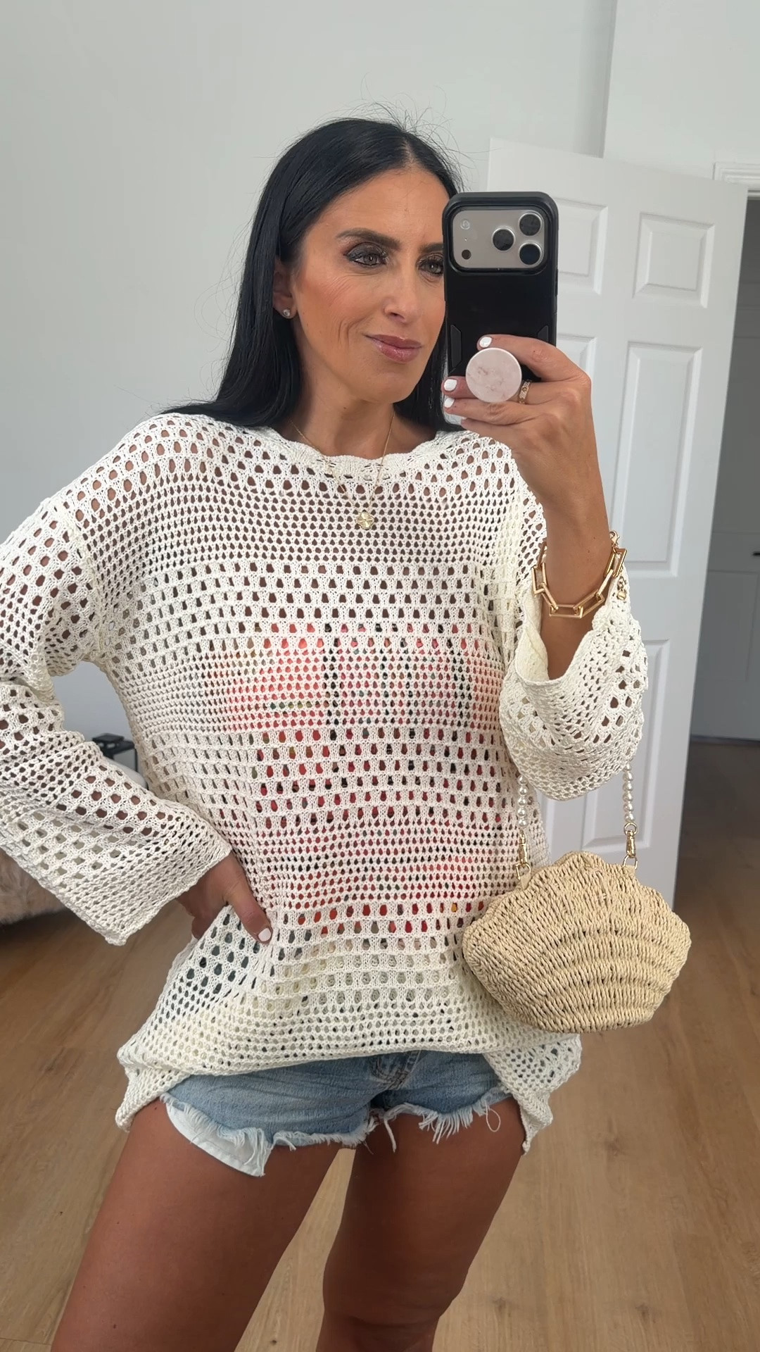 Women’s crochet swimsuit coverup wearing size medium.