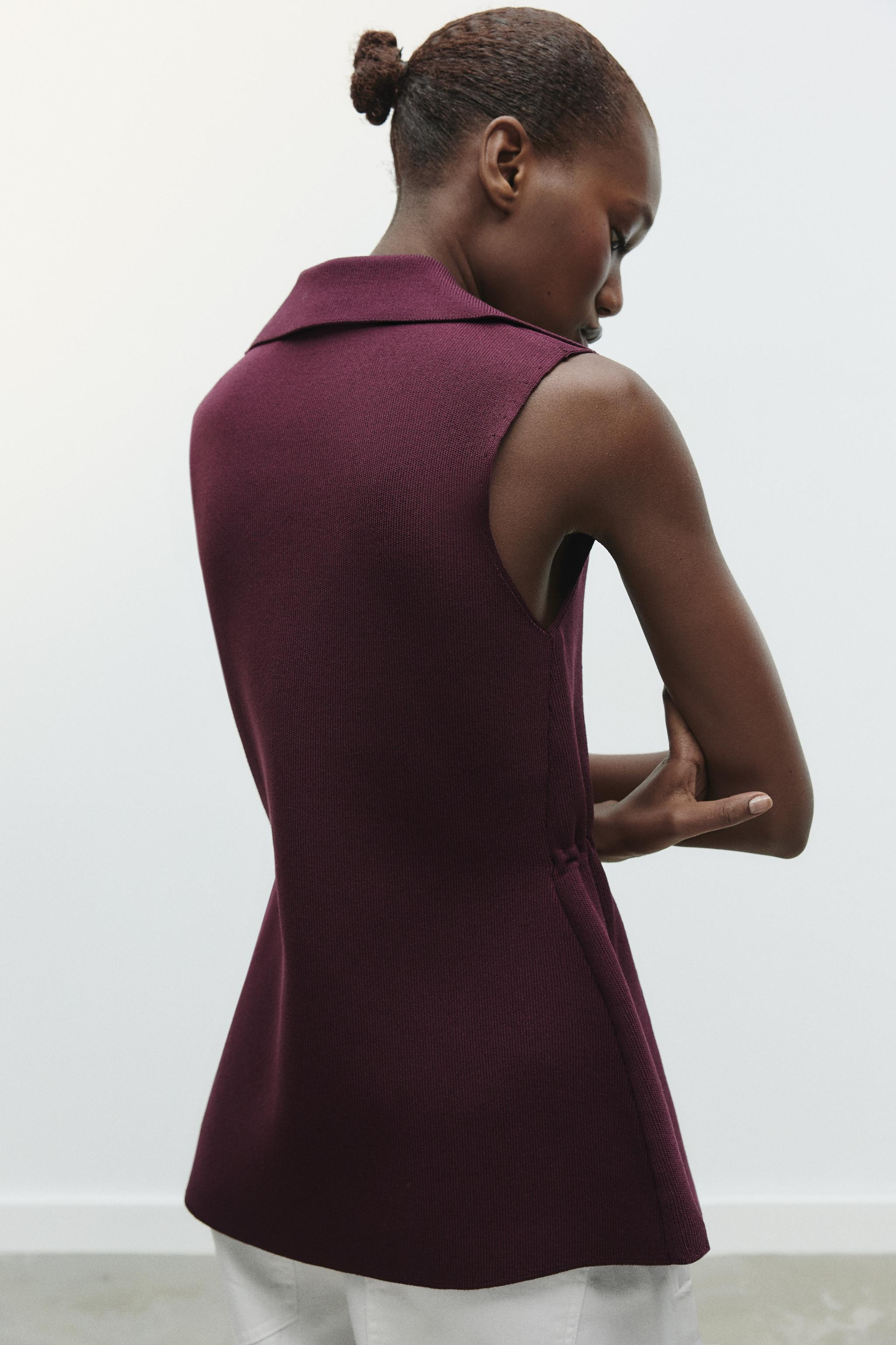 Plain knit vest with lapel collar and sleeveless. Elastic side gathers detail. Gold button front ... | Zara US