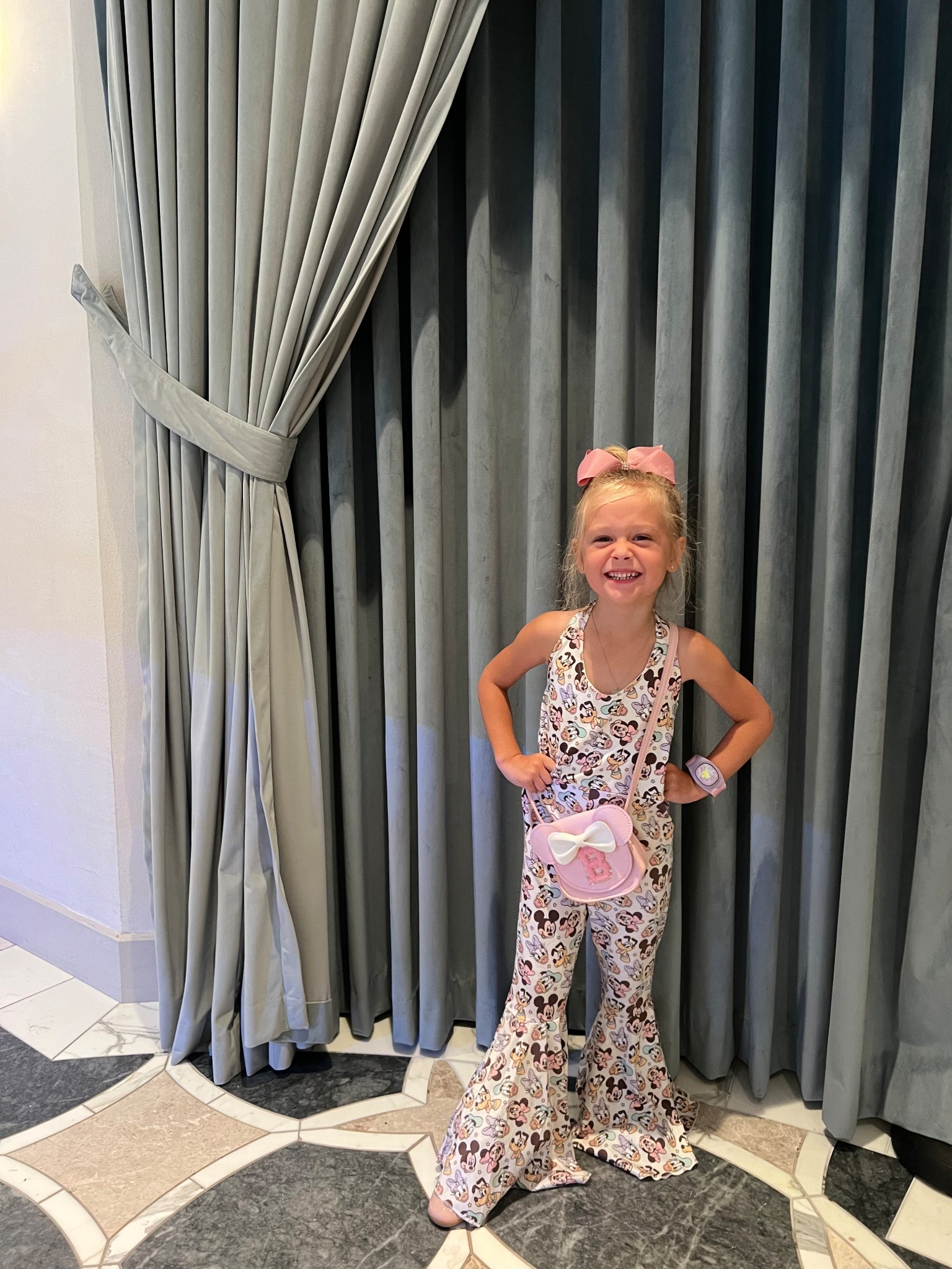 Mickey & friends bell bottoms jumpsuit. It’s super soft & the tie around the neck makes it adjustable as they grow. I selected the bow to be sent with it  

#LTKTravel #LTKKids