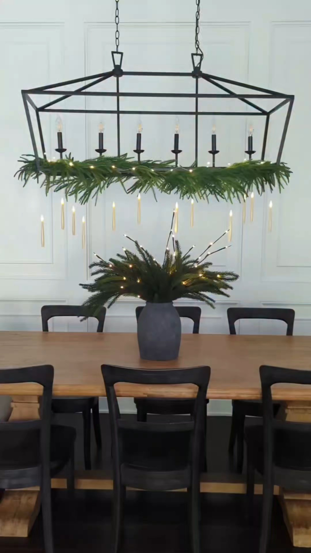 Christmas dining room decor. Hogwarts Christmas. Floating candles. Great Hall vibes. Harry Potter Christmas. Elegant Christmas. Dark red bows. Burgundy ribbon. The Norfolk garland on chandelier is from Walmart website. String lights on top. Pine stems. Lit Birch branch stems. Mini cedar wreaths from Hobby Lobby. DIY swag with two pine stems tied with floral wire and a red bow on top. Stuck to the wall with command hook. #Christmas #LTKfind

#LTKHoliday #LTKSeasonal #LTKHome