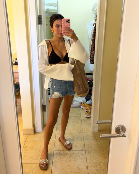 Beach day outfit of the day 🌊☀️ these jean shorts are a summer staple that I’ve had for years & this beach bag is the best ever!

Sizing:
Swimsuit- M
White button up- M
Denim shorts- 26

Resort wear; travel outfit; beach outfit; black bikini; distressed denim shorts; white coverup; mesh beach bag; Stuart Weitzman; Amazon fashion

#LTKstyletip #LTKtravel #LTKunder50