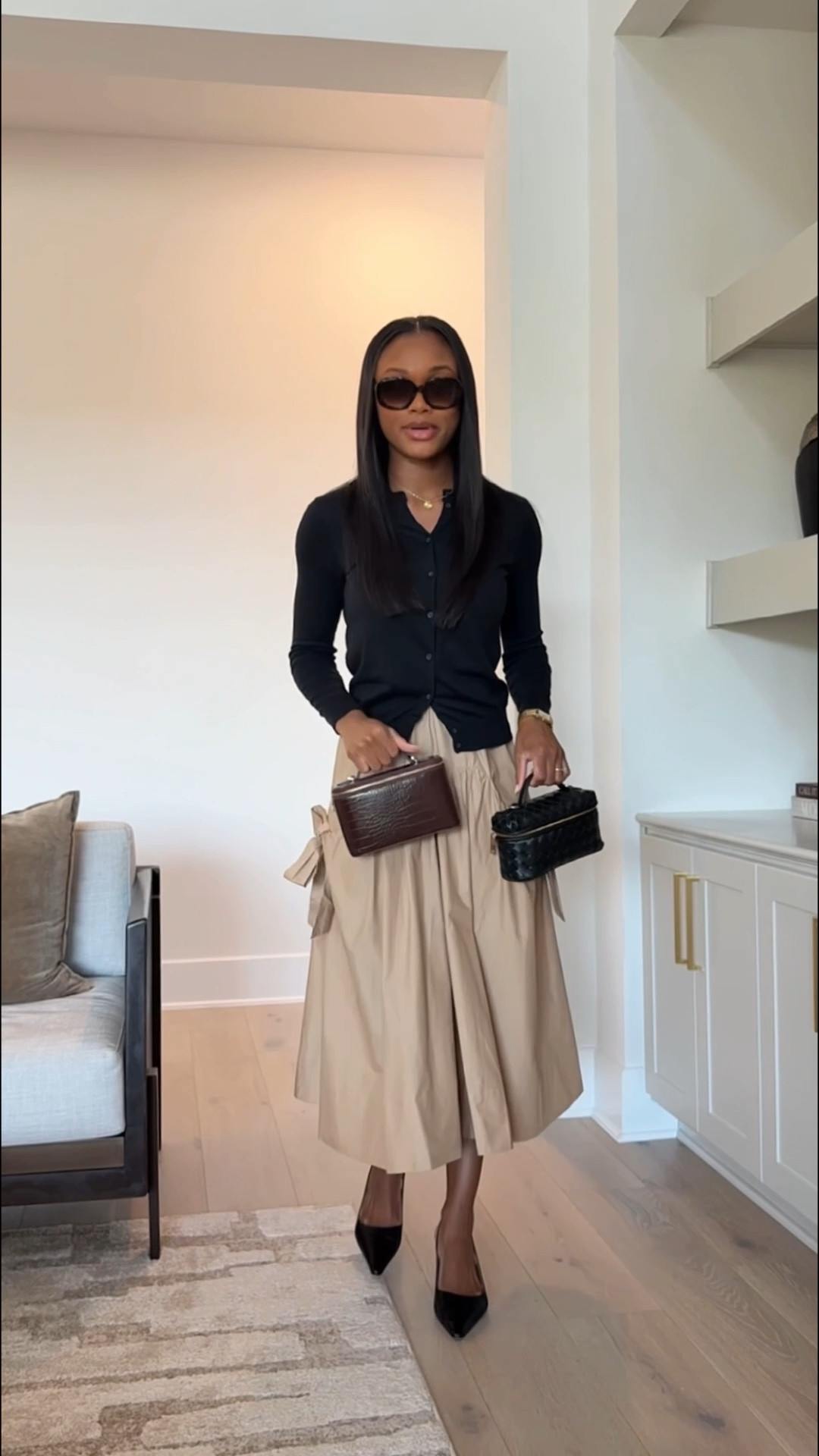 Outfit of the day | classic black cardigan, bow midi skirt, black slingback heels, vanity bag, spring fashion, chic sunglasses 

#LTKootd #LTKgrwm #LTKWorkwear