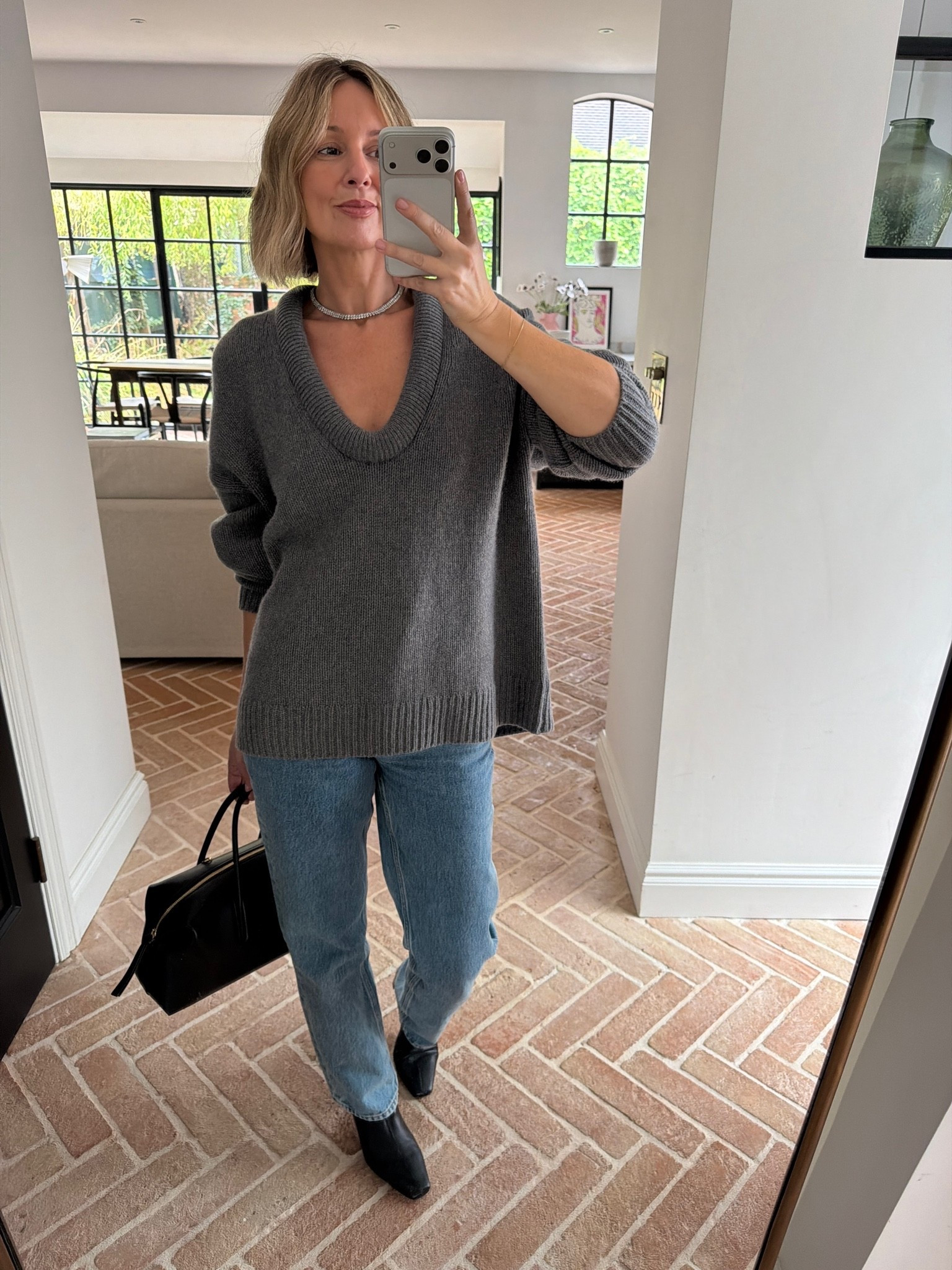 grey oversized v neck sweater, cowl neck jumper, straight leg jeans, light wash denim, black leather handbag, structured tote, black ankle boots, diamond choker necklace, layered jewelry, autumn outfit, transitional dressing, everyday knitwear, quiet luxury, elevated basics, effortless chic, ltkstyletip, ltkseasonal, ltkfindsunder100, outfit inspo, capsule wardrobe essentials

#LTKFashionMonth #LTKeurope #LTKpartywear