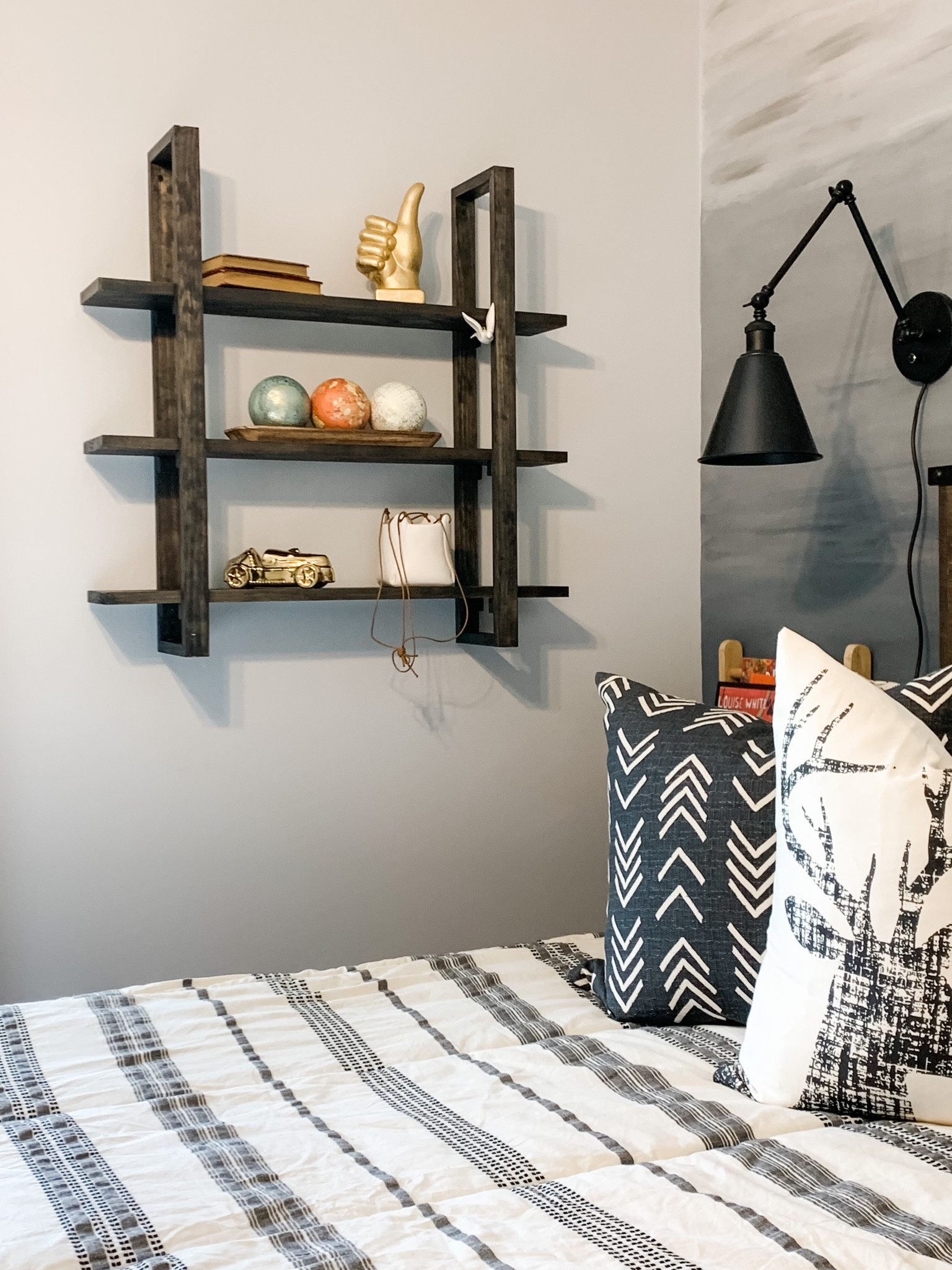 Shelf Styling 😍
Are you stuck on what to use for styling shelves? Plants are usually my go-to, but in a room without much light, that’s not an option. 
I mixed gold decor in with whimsical items, based on my son’s interests. A book stack, a “thumbs up,” 3 world globe orbs in a wooden tray, a vintage car piggy bank, and a ceramic bag to hide a few items. It works well for him. 

#shelfdecor #kidsrooms #bedroom #homedecor #wallshelf #lights #kidsdecor #bedroomdecor


#LTKunder50 #LTKhome #LTKkids