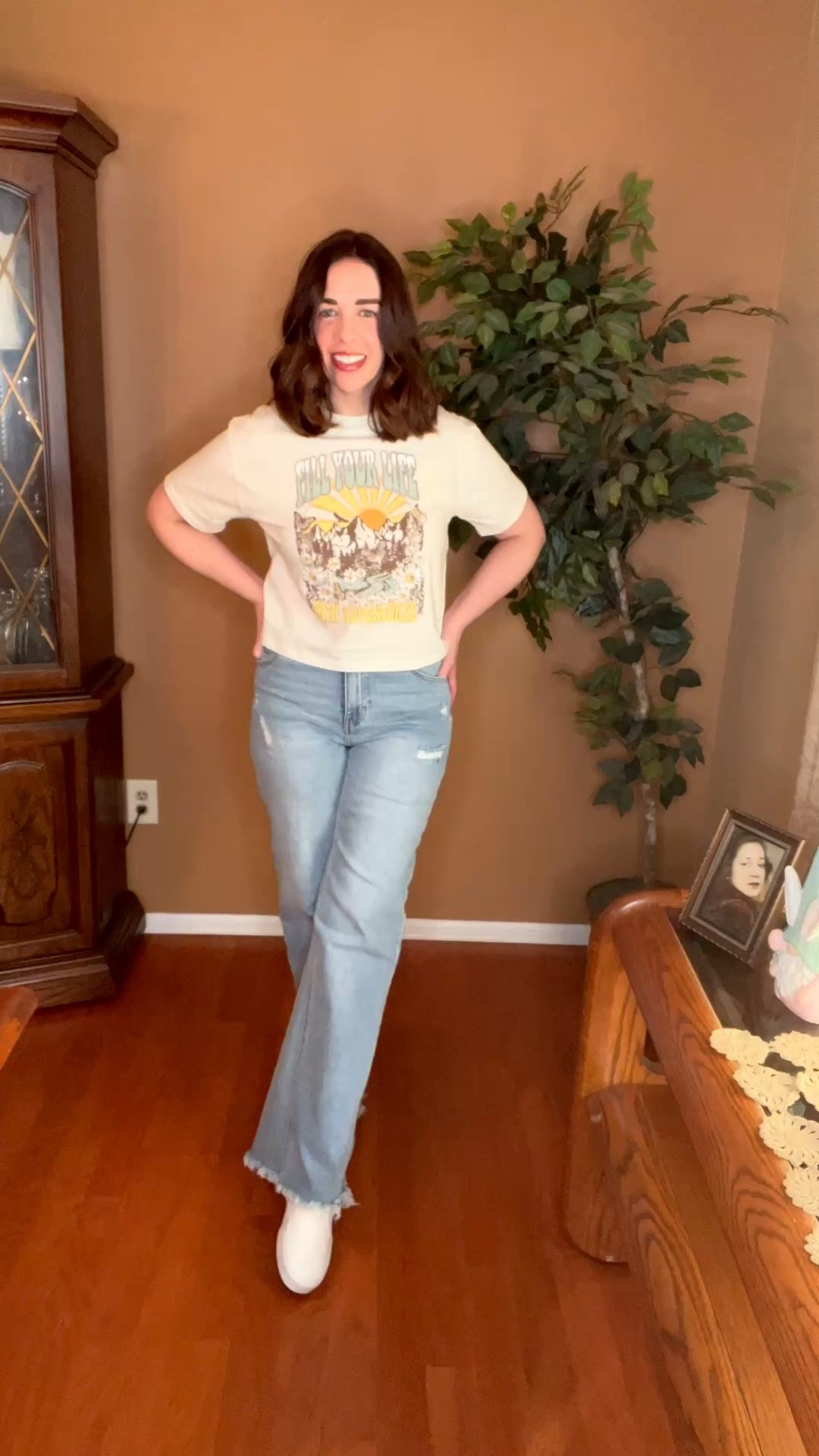 Graphic t-shirt (xs). High waisted wide leg jeans (27). White slip on sneakers (8.5). #tshirt #graphictshirt #widelegjeans #highwaistedjeans #sneakers #sliponsneakers #whitesneakers #springoutfits 
spring outfits 2026 @DSW @tjmaxx 

#LTKSeasonal #LTKootd