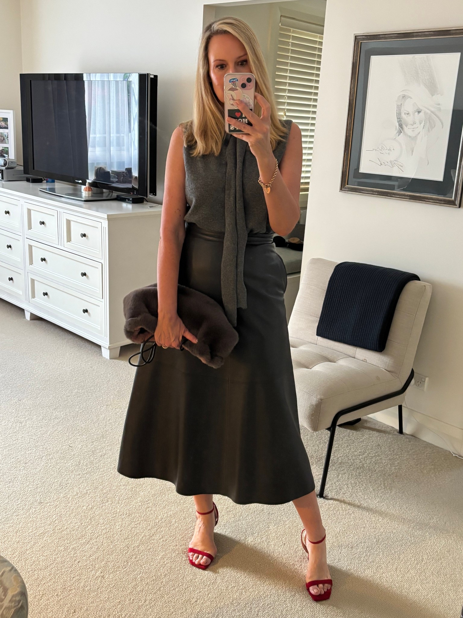 Off to dinner with some friends tonight! Wearing my favourite leather skirt with a cosy knit both from Scanlan Theodore. A fluffy bag from Zara and some red wedges from Edward Meller 

#LTKspring #LTKaustralia #LTKover50style