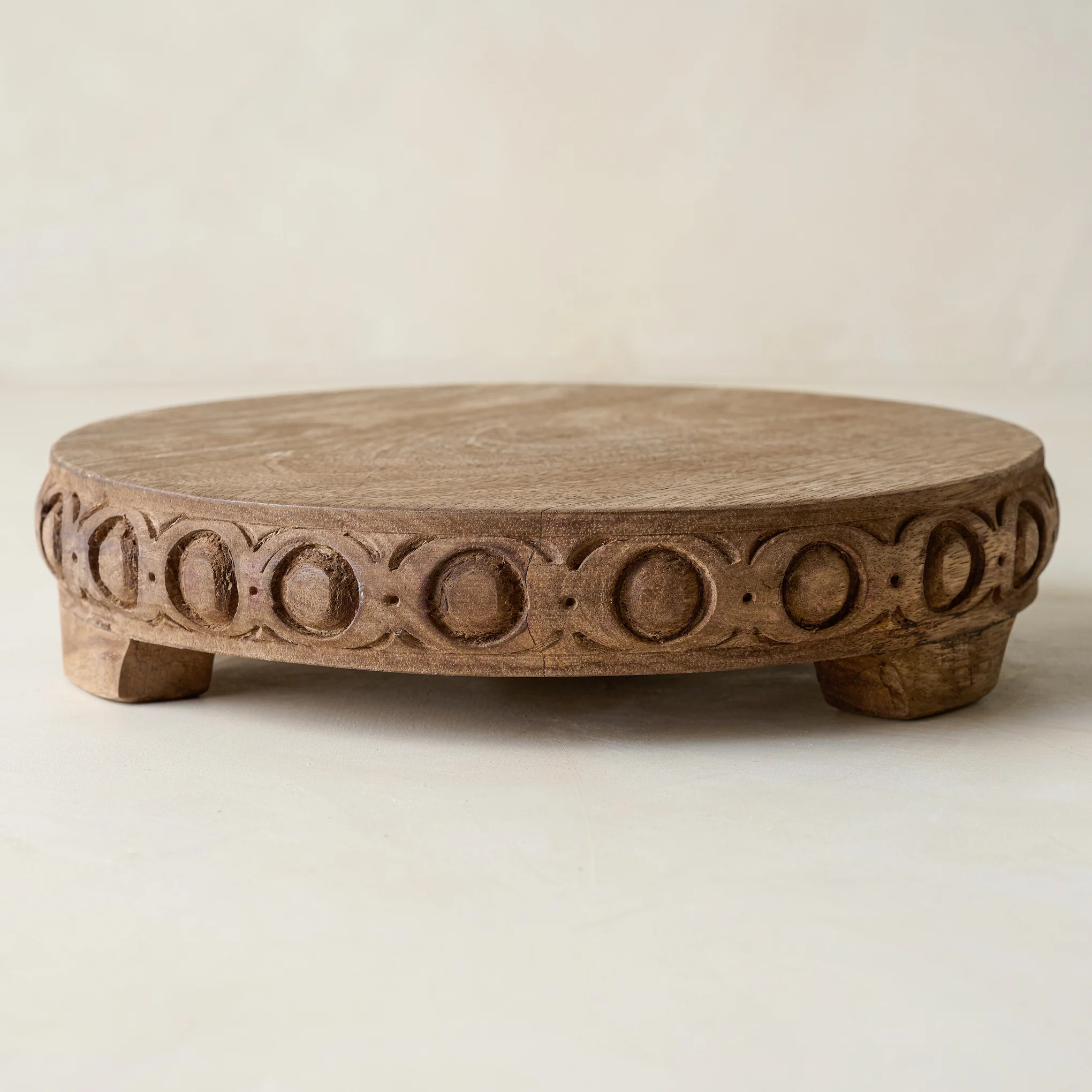 Antiqued Carved Wood Round Riser | Magnolia