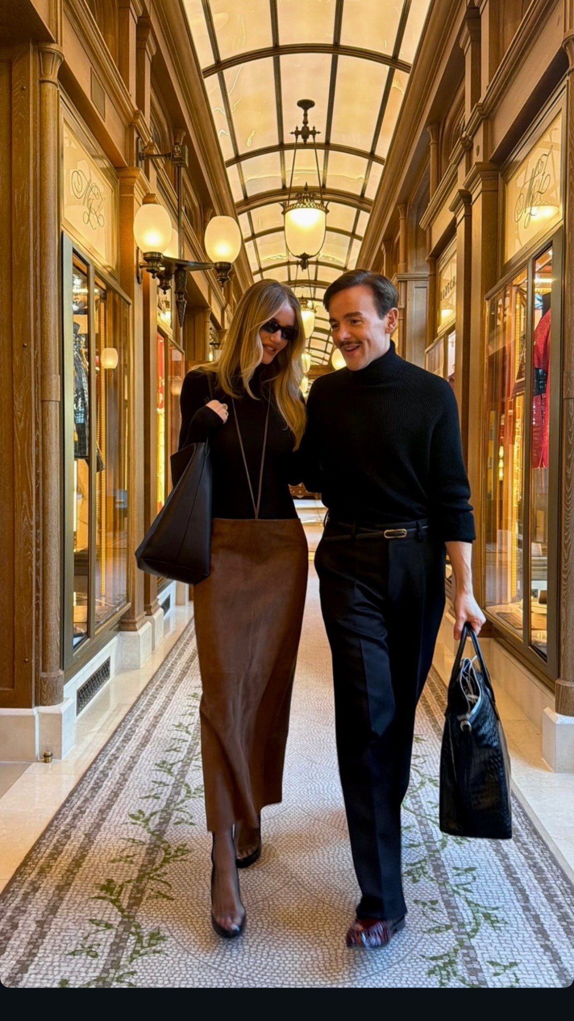 Rosie Huntington Whiteley's Suede Pencil Skirt, Wool Turtleneck Top and sunglasses embody graphic precision in a sleek, shallow silhouette that looks to the 1990 leather handbag ￼