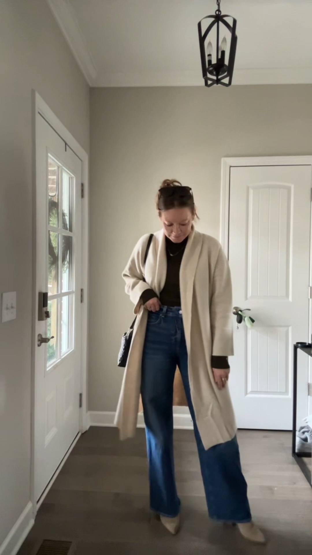 Turtleneck / tts wearing a medium 
Long open cardigan / tts 
Wide leg jeans / tts wearing a 29
Booties
Evil eye necklace 
Sunglasses 
Woven bag 

#LTKFindsUnder50 #LTKootd #LTKFindsUnder100