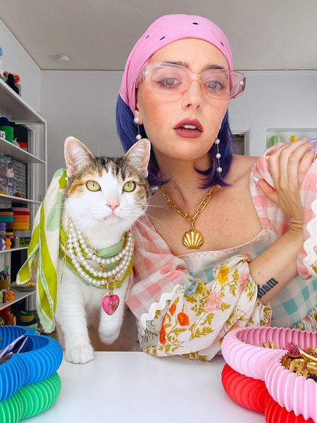 sugar spice and everything nice 🐱💖🌈🌸✨

Champagne wears a multi colored, pastel floral, gingham, midi dress with pearl string earrings, gold shell, necklace, pink rose, sunglasses, and a pink scarf. Pony wears a string of pearls and a pink heart necklace and green scarf. 

Dopamine dressing, maximalist Maximalism, colorful Besty cat cats, style fashion, unique, vibrant eccentric. 

#LTKstyletip #LTKbeauty #LTKSeasonal