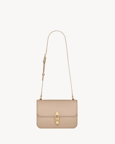 bag with front flap decorated with a saint laurent paris-engraved square clip fastening, featurin... | Saint Laurent Inc. (Global)