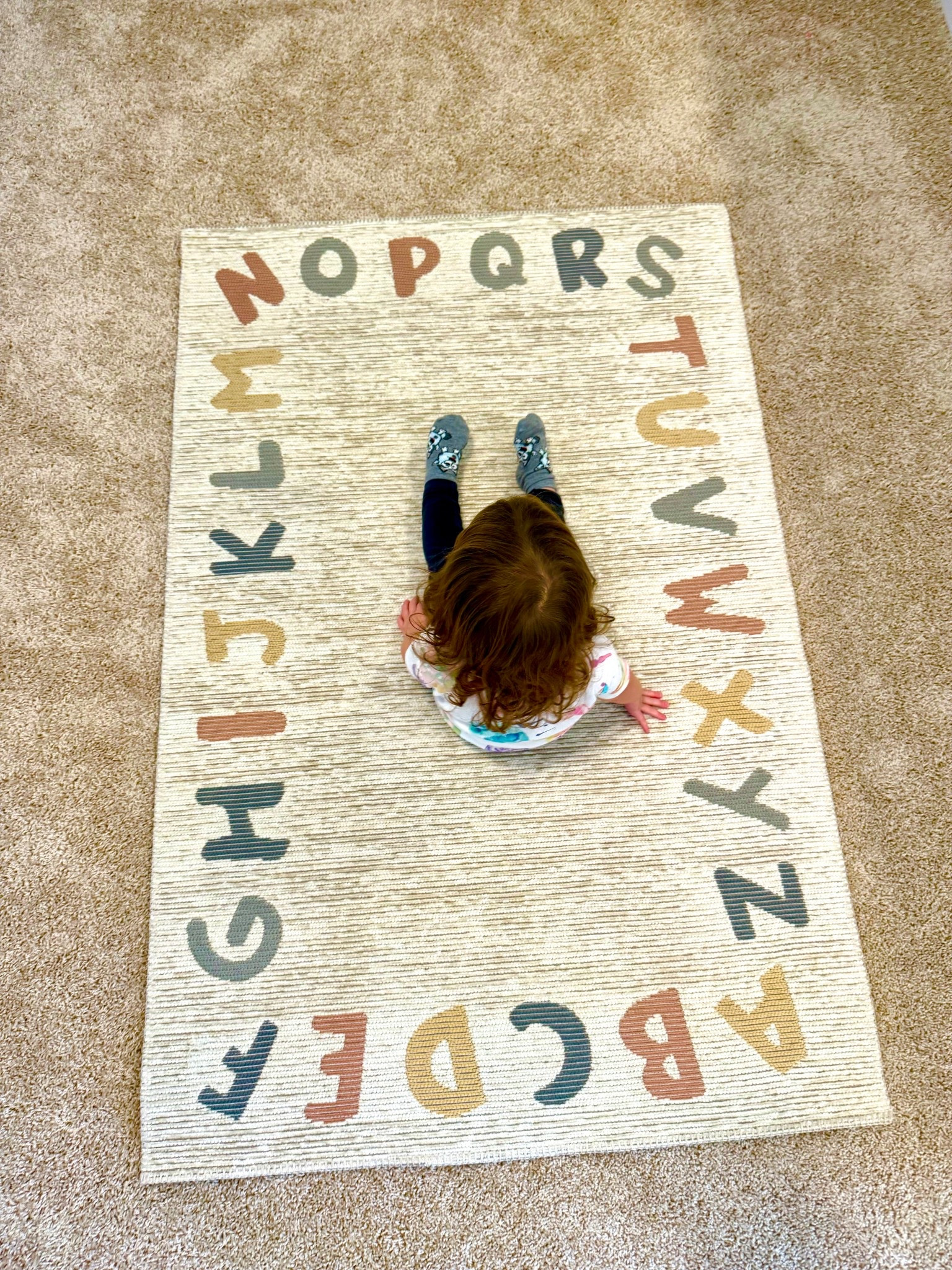 The cutest little rug!! We put this in our play room and it’s been so fun seeing her point out and name each letter!! #playroom #toddler #toddlerdecor 