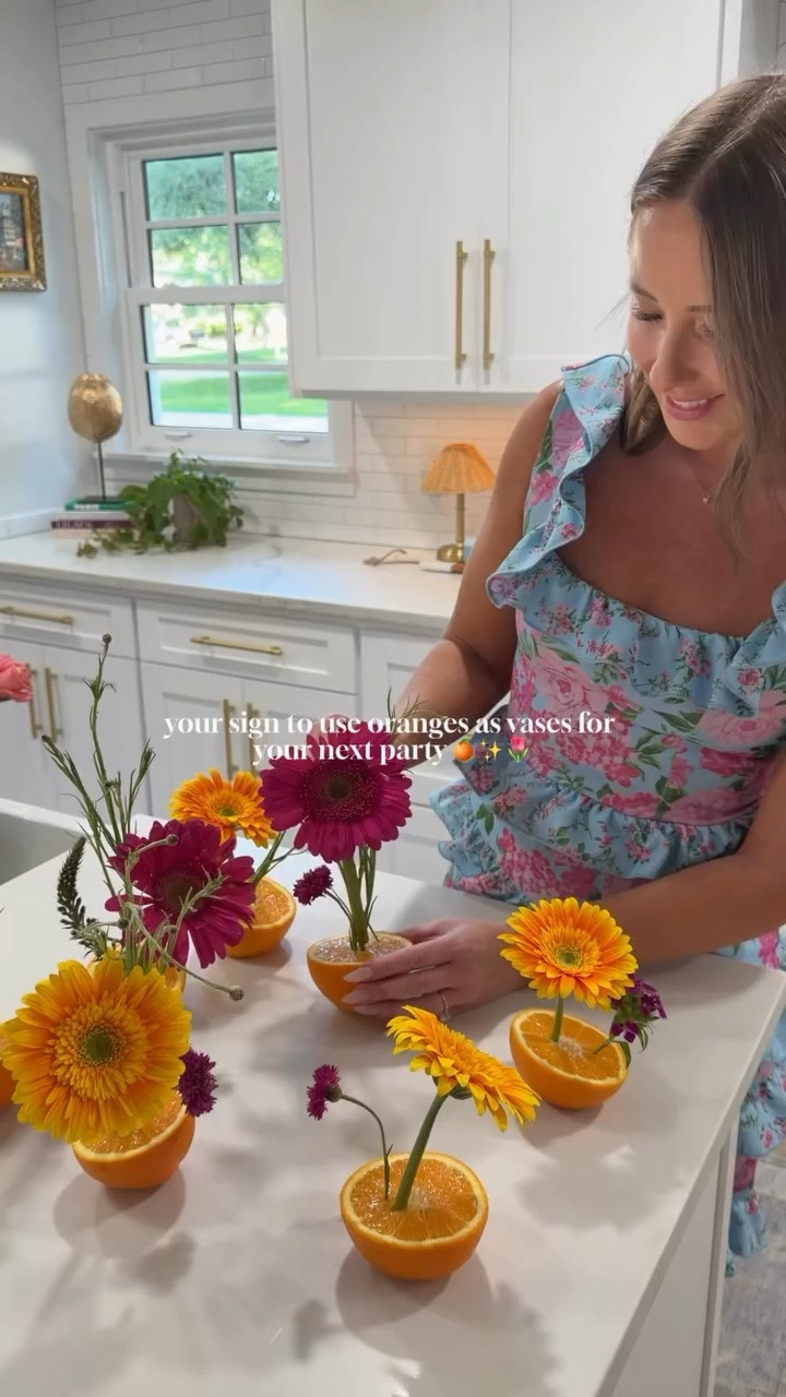 Garden Summer Party Hosting Idea🍊✨🌷 I think using oranges as vases is my new go-to! It’s so easy and it makes a tablescape look so pretty!

Pro-tip: cut a small slice off the bottom of each orange so the orange lays flat on your table and doesn’t tip over! I didn’t have to use toothpicks - my flowers all stuck upright in the oranges perfectly. Prepare 1-2 hours before your event to prolong the flowers and oranges!

+ The beautiful flowers are from @sydneynichole 🌷
+ The majority of amazing tablescape + chairs were rented from @curatedeventscollective - they have everything you can imagine to rent for any event - think wedding, rehearsal dinner, corporate event and more! 

Comment SPRING for candle and other details!
