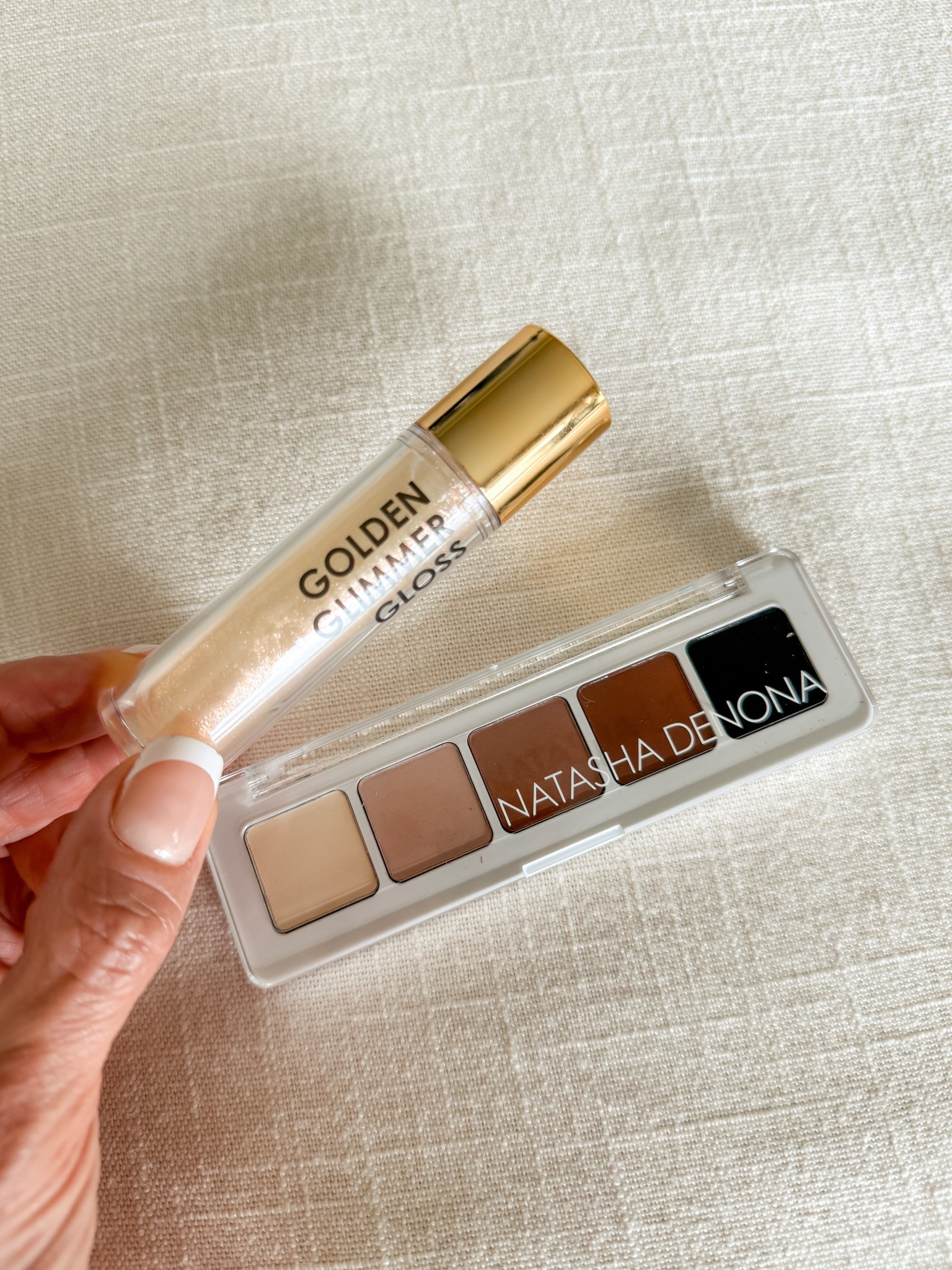 New summer makeup! Super excited about this little mini pallet and this golden shimmer gloss! These are going to be perfect for an easy on the go Summer look! Love the feel of this gloss! And these eyeshadow colors are perfection and they are so easy to use! The small pallet will be great for travel!
@Natasha Denona 
#sponsored

#LTKTravel #LTKOver40 #LTKBeauty