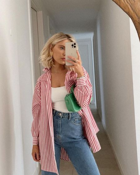 Spring outfit inspo | Red and white striped button down, white tank top and jeans. 

Oversized red and white striped shirt on sale now!

#LTKSeasonal #LTKstyletip #LTKsalealert